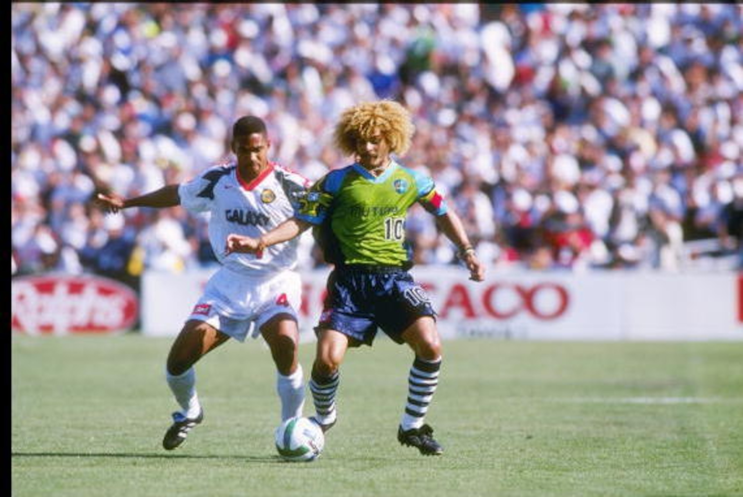16 Jun 1996: Carlos Valderrrama #10 of the Tampa Bay Mutiny fends off Robin Fraser of the Los Angeles Galaxy during the Mutiny 3-2 MLS loss to the Galaxy at the Rose Bowl in Pasadena, California. Mandatory Credit: Stephen Dunn /Allsport 16 Jun 1996: Carlos Valderrrama #10 of the Tampa Bay Mutiny fends off Robin Fraser of the Los Angeles Galaxy during the Mutiny 3-2 MLS loss to the Galaxy at the Rose Bowl in Pasadena, California. Mandatory Credit: Stephen Dunn /Allsport