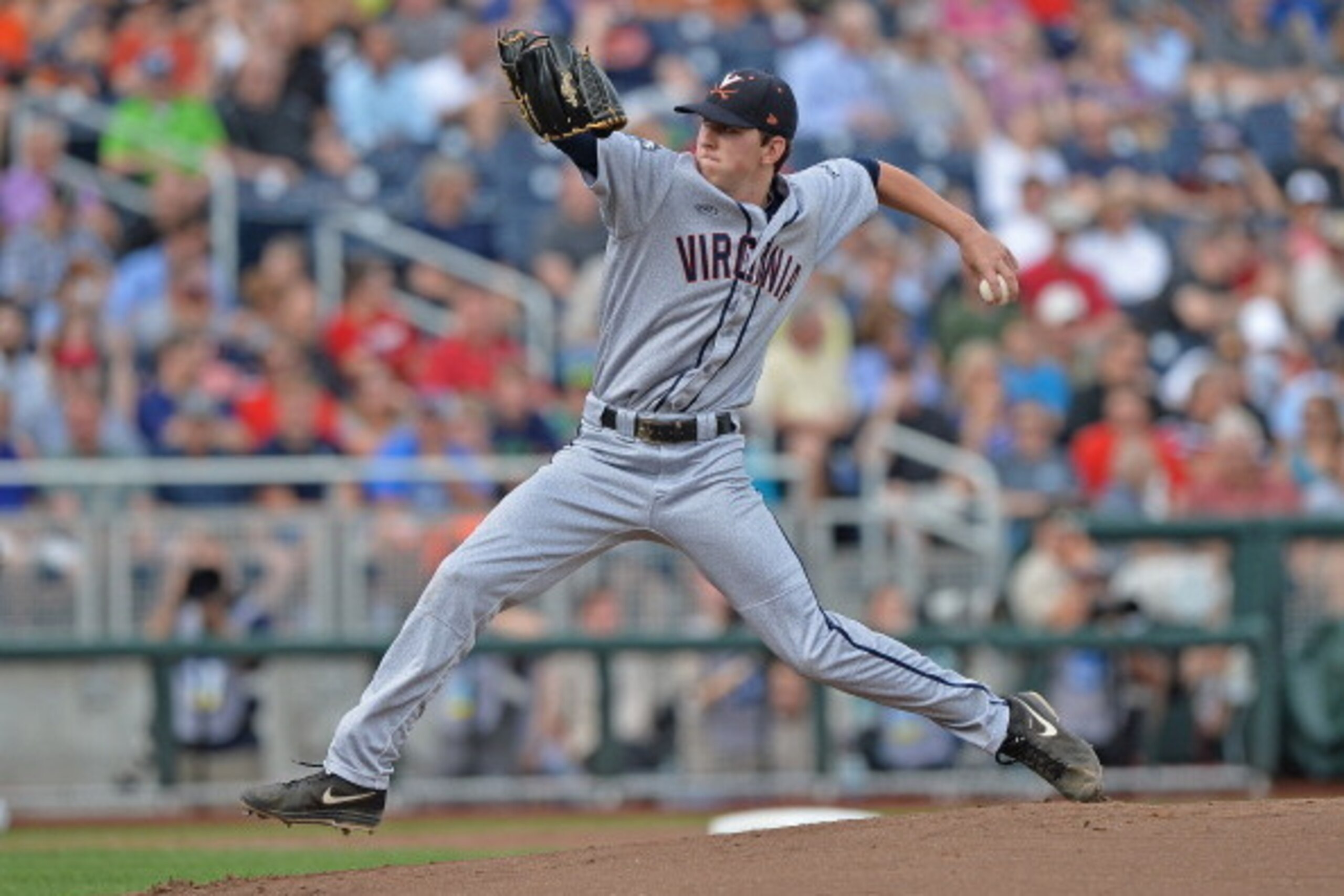 OMAHA, NE - JUNE 24:  Brandon Waddell #20 of the Virginia Cavaliers delivers a pitch against the Vanderbilt Commodores in the first inning during game two of the College World Series Championship Series on June 24, 2014 at TD Ameritrade Park in Omaha, Neb