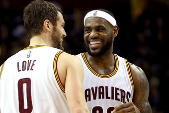 CLEVELAND, OH - DECEMBER 23:  LeBron James #23 and Kevin Love #0 of the Cleveland Cavaliers react after a play in the second half against the Minnesota Timberwolves at Quicken Loans Arena on December 23, 2014 in Cleveland, Ohio. NOTE TO USER: User express
