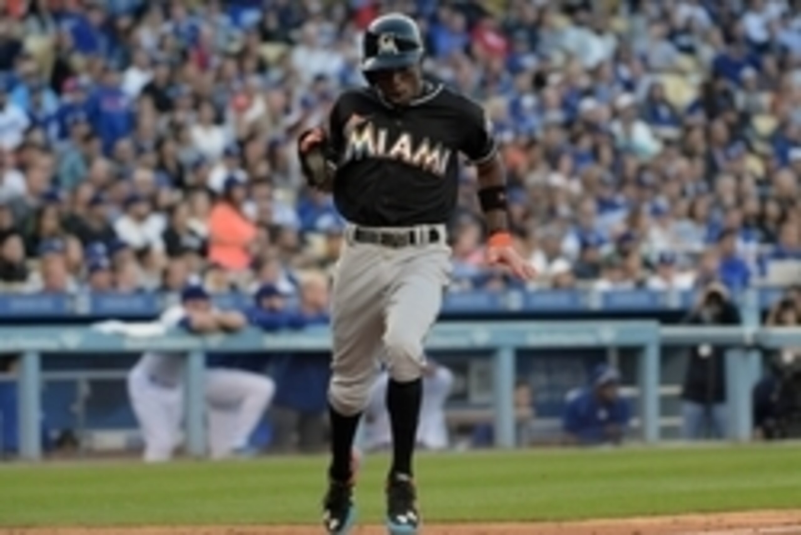 May 13, 2015; Los Angeles, CA, USA; Miami Marlins shortstop Dee Gordon (9) celebrates after scoring in the seventh inning against the Los Angeles Dodgers at Dodger Stadium. The Marlins defeated the Dodgers 5-4. Mandatory Credit: Kirby Lee-USA TODAY Sports May 13, 2015; Los Angeles, CA, USA; Miami Marlins shortstop Dee Gordon (9) celebrates after scoring in the seventh inning against the Los Angeles Dodgers at Dodger Stadium. The Marlins defeated the Dodgers 5-4. Mandatory Credit: Kirby Lee-USA TODAY Sports