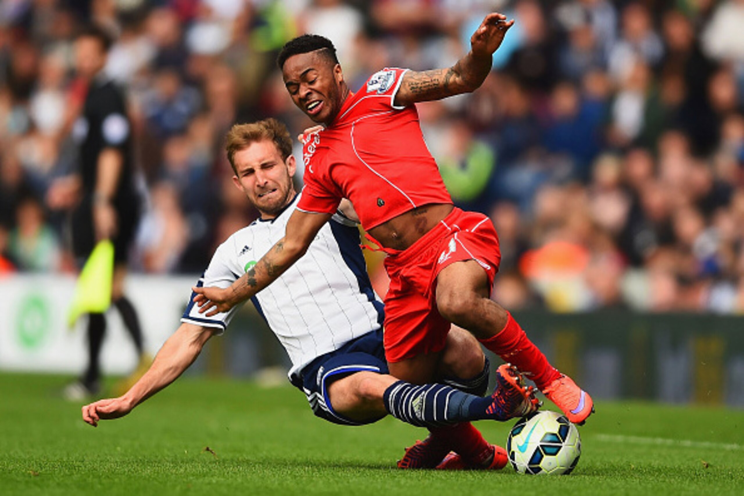 WEST BROMWICH, ENGLAND - APRIL 25:  Craig Dawson of West Brom tackles Raheem Sterling of Liverpool during the Barclays Premier League match between West Bromwich Albion and Liverpool at The Hawthorns on April 25, 2015 in West Bromwich, England.  (Photo by