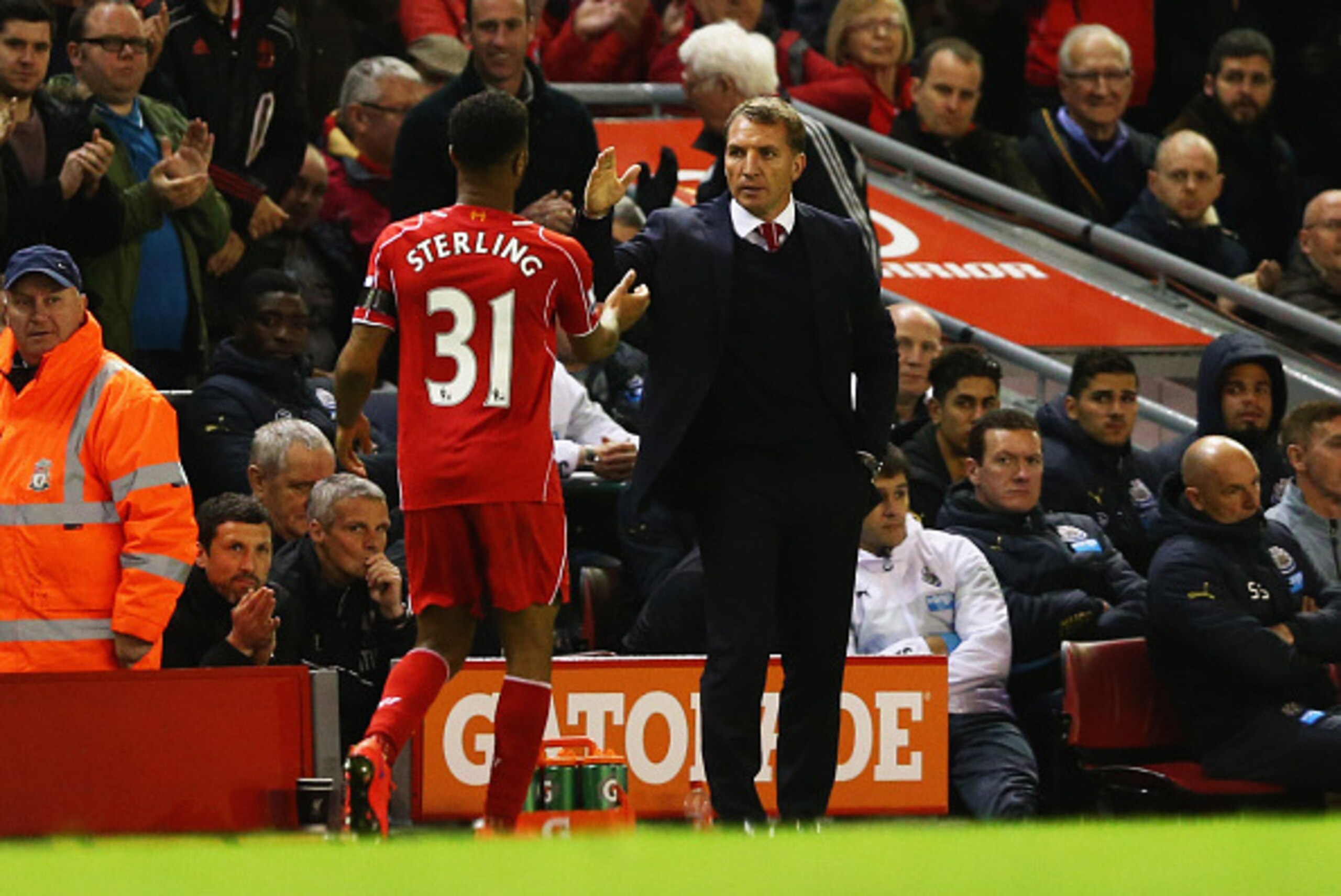 LIVERPOOL, ENGLAND - APRIL 13:  Brendan Rodgers manager of Liverpool shakes hands with Raheem Sterling of Liverpool as he is substituted during the Barclays Premier League match between Liverpool and Newcastle United at Anfield on April 13, 2015 in Liverp