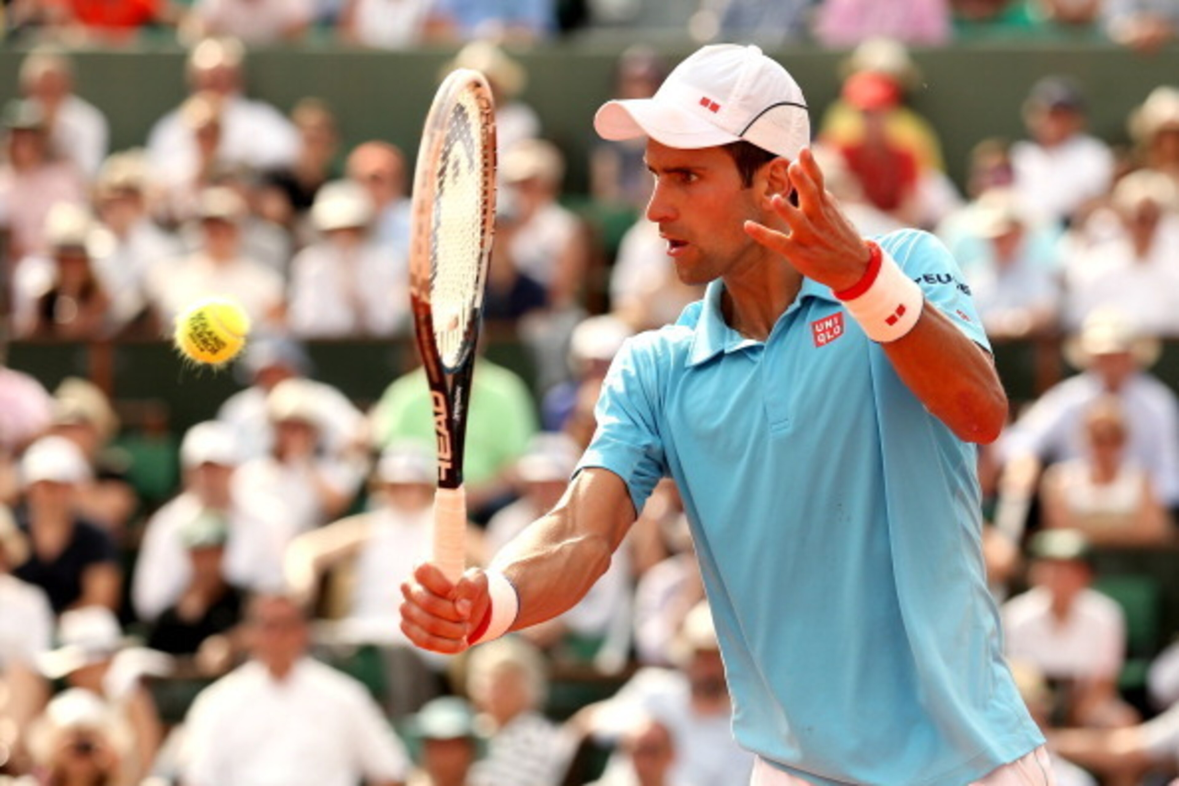 PARIS, FRANCE - JUNE 08:  Novak Djokovic of Serbia returns a shot during his men's singles final match against Rafael Nadal of Spain on day fifteen of the French Open at Roland Garros on June 8, 2014 in Paris, France.  (Photo by Matthew Stockman/Getty Ima