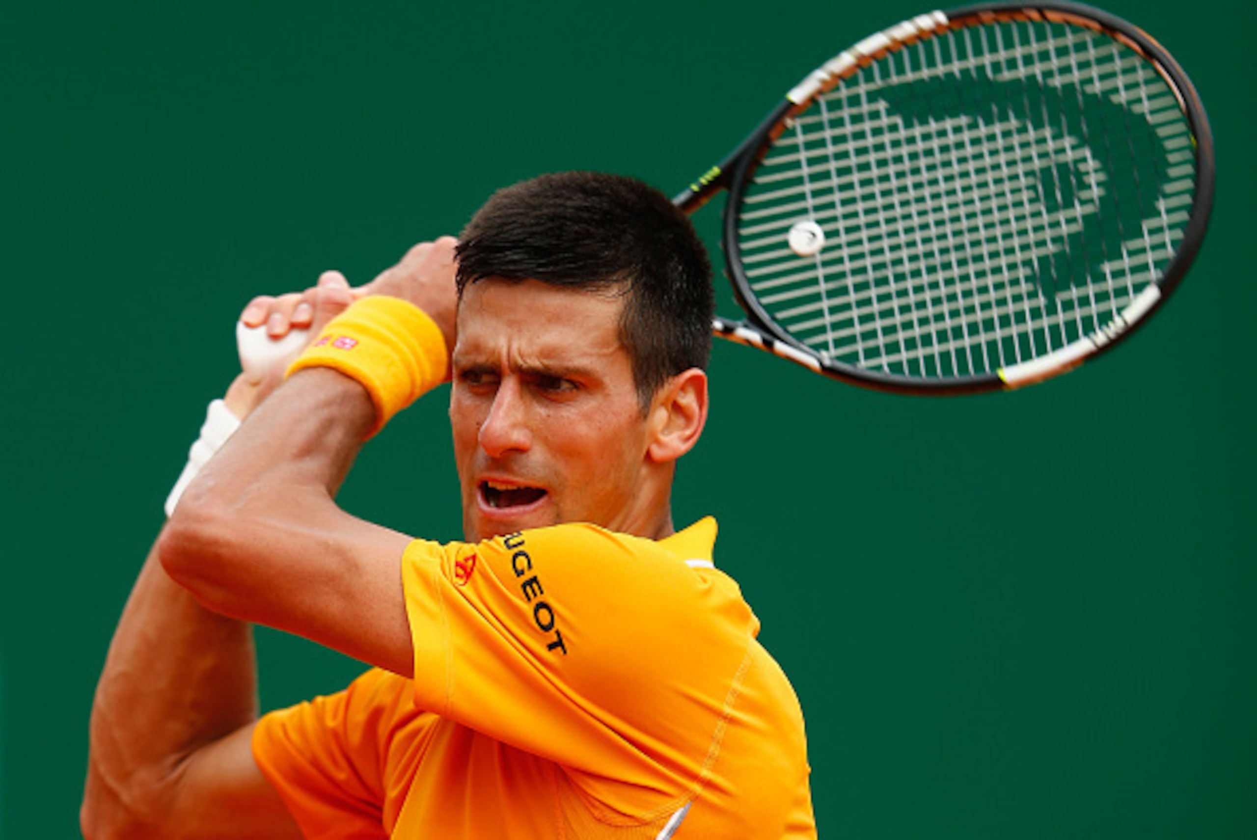 MONTE-CARLO, MONACO - APRIL 18: Novak Djokovic of Serbia plays a backhand to Rafael Nadal of Spain in the semi finals during day seven of the Monte Carlo Rolex Masters tennis at the Monte-Carlo Sporting Club on April 18, 2015 in Monte-Carlo, Monaco. (Ph MONTE-CARLO, MONACO - APRIL 18: Novak Djokovic of Serbia plays a backhand to Rafael Nadal of Spain in the semi finals during day seven of the Monte Carlo Rolex Masters tennis at the Monte-Carlo Sporting Club on April 18, 2015 in Monte-Carlo, Monaco. (Ph