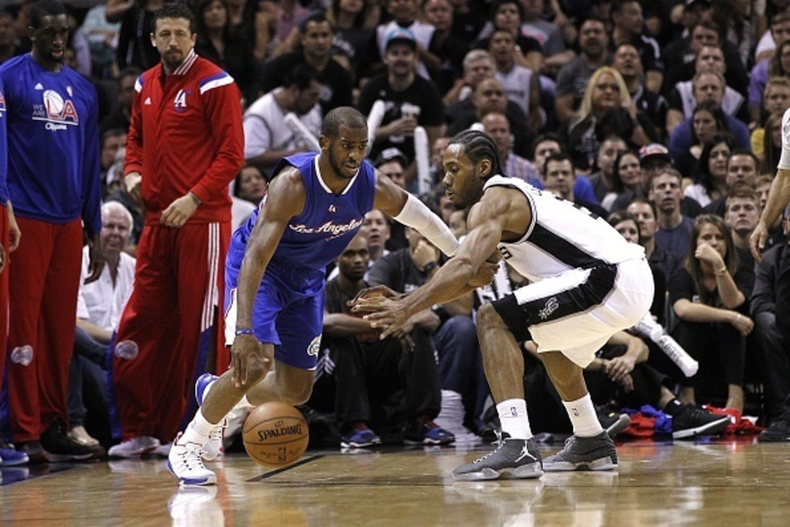 SAN ANTONIO, TX - APRIL 30: Chris Paul #3 of the Los Angeles Clippers drives around Kawhi Leonard #2 of the San Antonio Spurs during Game Six of the Western Conference quarterfinals of the 2015 NBA Playoffs at the AT&T Center on April 30, 2015 in San Anto