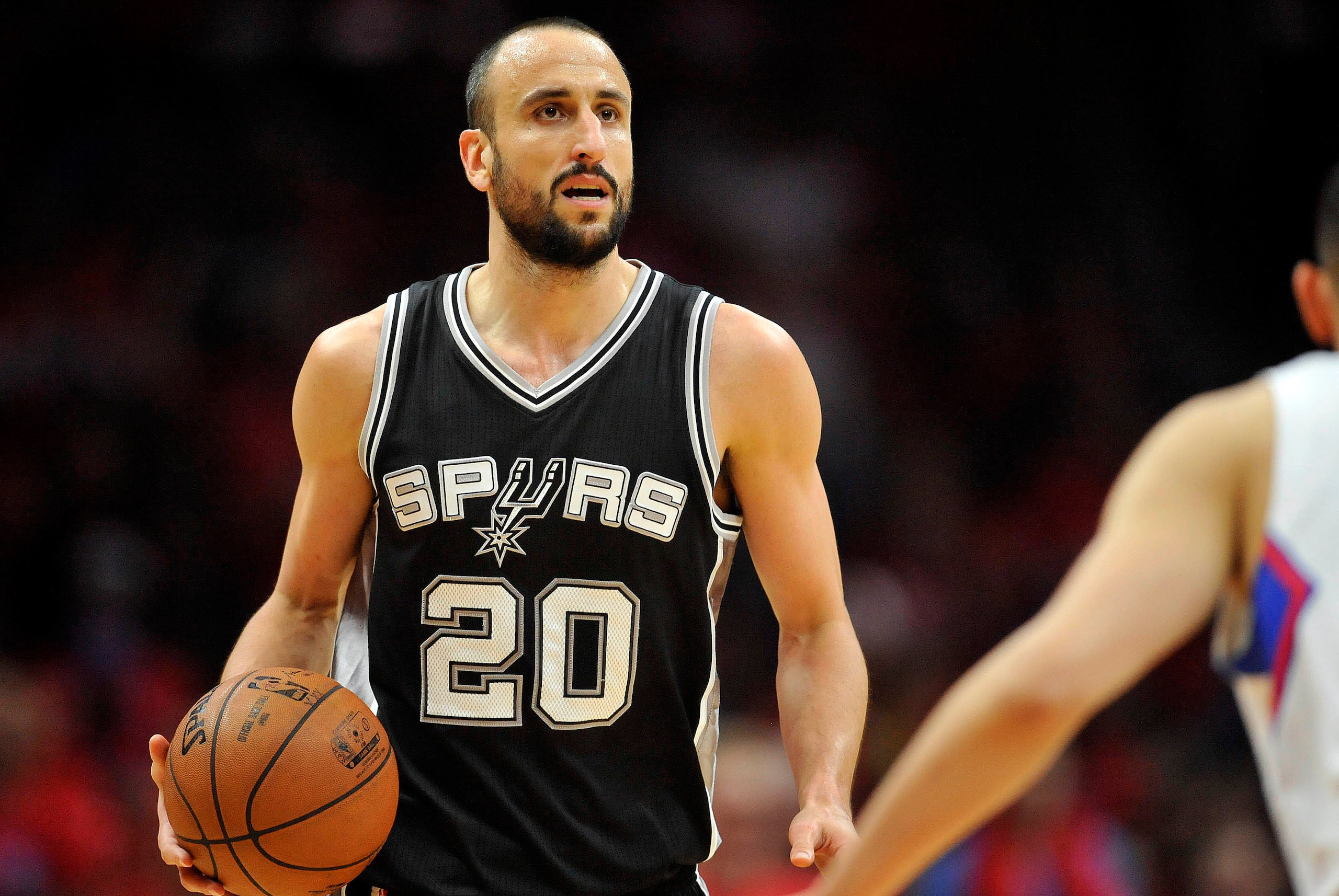 April 22, 2015; Los Angeles, CA, USA; San Antonio Spurs guard Manu Ginobili (20) controls the ball against the Los Angeles Clippers during the second half in game two of the first round of the NBA Playoffs. at Staples Center. Mandatory Credit: Gary A. Vas