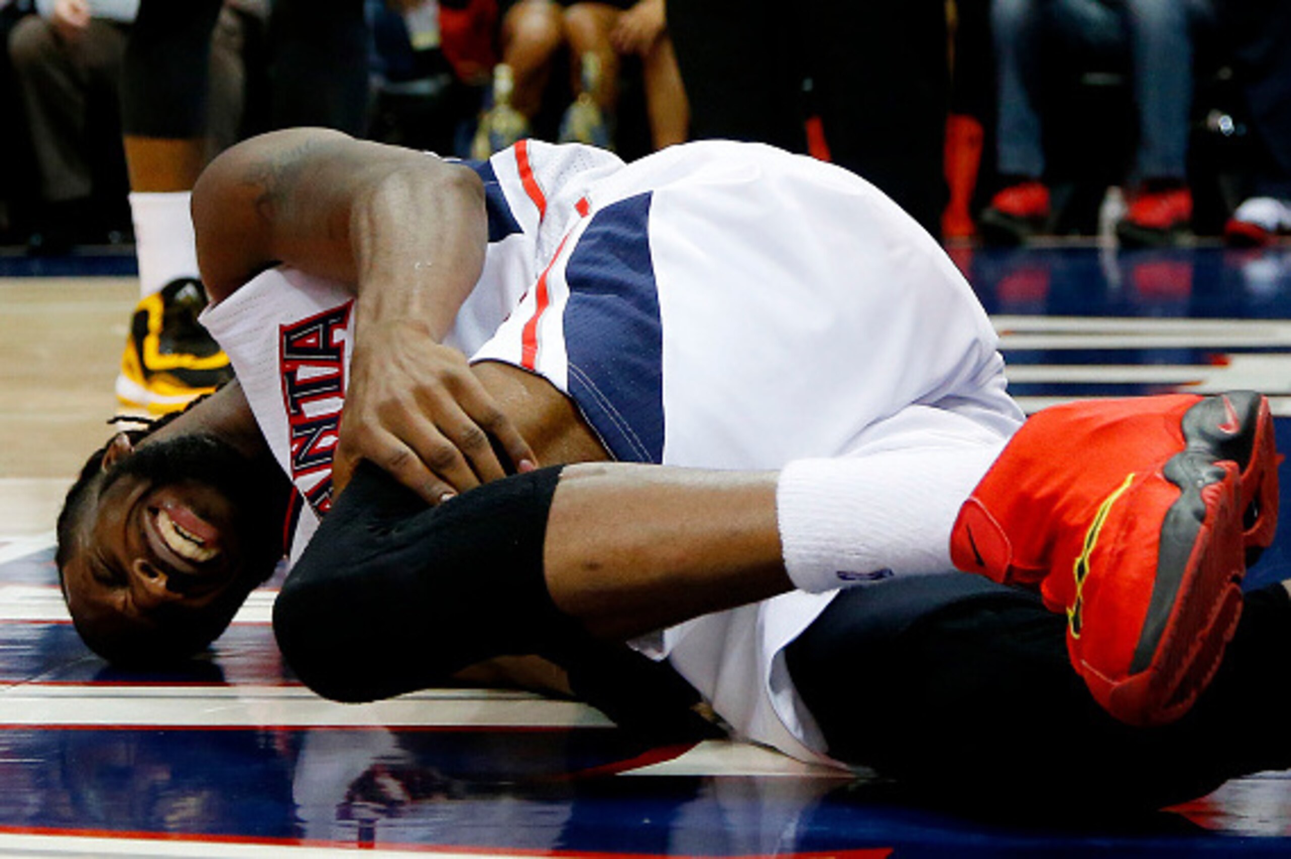 ATLANTA, GA - MAY 20:  DeMarre Carroll #5 of the Atlanta Hawks reacts after injuring his left leg in the fourth quarter against the Cleveland Cavaliers during Game One of the Eastern Conference Finals of the 2015 NBA Playoffs at Philips Arena on May 20, 2