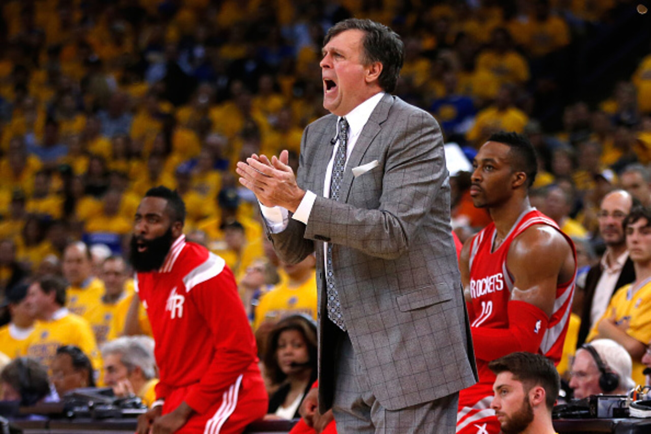 OAKLAND, CA - MAY 21: Kevin McHale of the Houston Rockets reacts on the sideline as Dwight Howard #12 and James Harden #13 look on against the Golden State Warriors during game two of the Western Conference Finals of the 2015 NBA PLayoffs at ORACLE Arena 