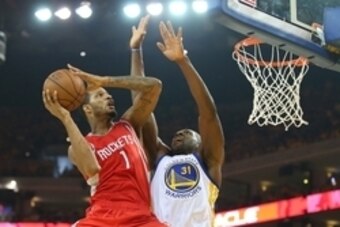 May 21, 2015; Oakland, CA, USA; Houston Rockets forward Trevor Ariza (1) moves to the basket against the defense of Golden State Warriors center Festus Ezeli (31) during the first half in game two of the Western Conference Finals of the NBA Playoffs. at O