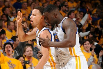 OAKLAND, CA - MAY 21: Stephen Curry #30 and Draymond Green #23 of the Golden State Warriors celebrate during a game against the Houston Rockets in Game Two of the Western Conference Finals of the 2015 NBA Playoffs on May 21, 2015 at Oracle Arena in Oaklan