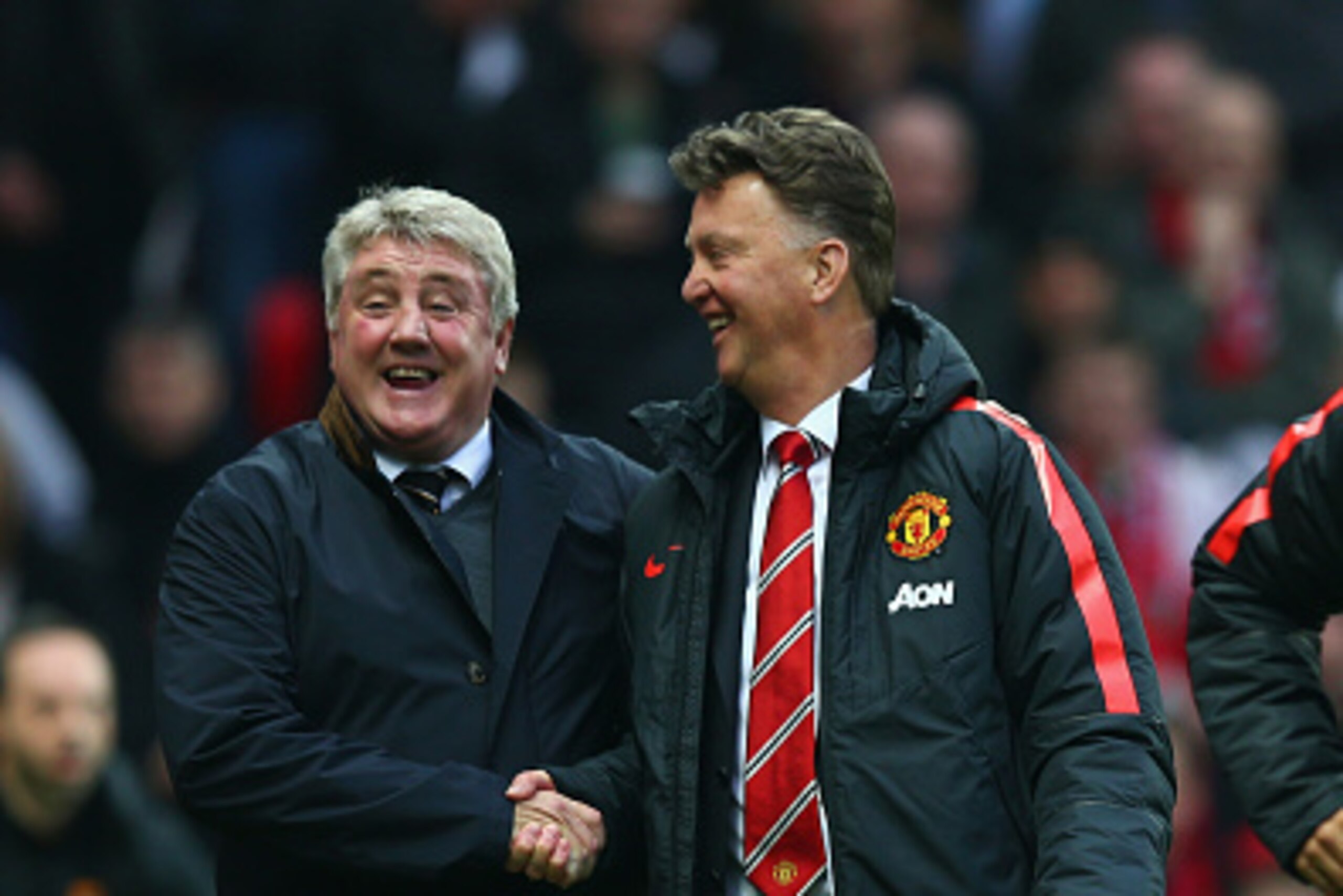 MANCHESTER, ENGLAND - NOVEMBER 29: Steve Bruce manager of Hull City and Manager Louis van Gaal of Manchester United share a joke during the Barclays Premier League match between Manchester United and Hull City at Old Trafford on November 29, 2014 in Manc MANCHESTER, ENGLAND - NOVEMBER 29: Steve Bruce manager of Hull City and Manager Louis van Gaal of Manchester United share a joke during the Barclays Premier League match between Manchester United and Hull City at Old Trafford on November 29, 2014 in Manc
