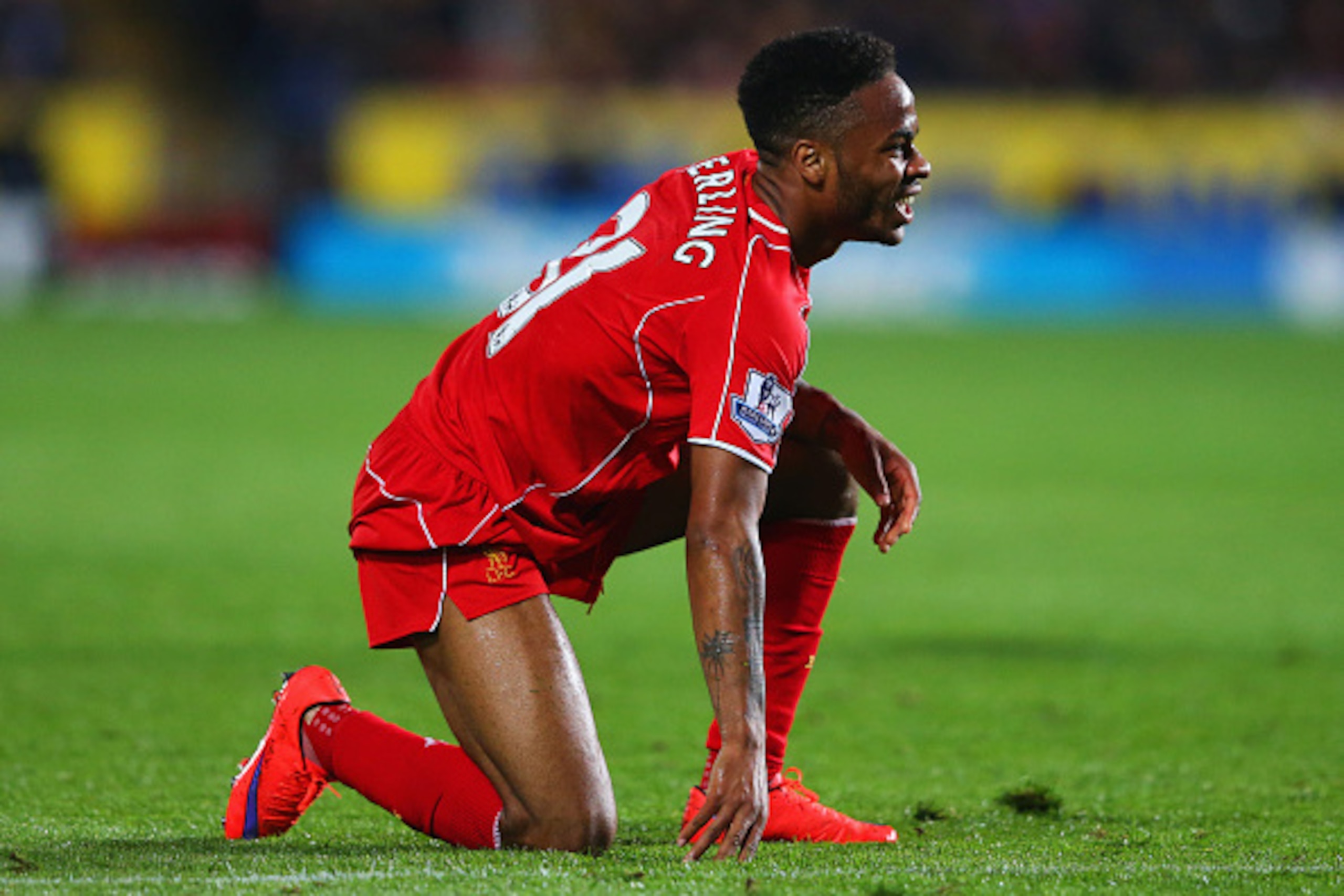 HULL, ENGLAND - APRIL 28:  Raheem Sterling of Liverpool kneels on the turf during the Barclays Premier League match between Hull City and Liverpool at KC Stadium on April 28, 2015 in Hull, England.  (Photo by Alex Livesey/Getty Images)