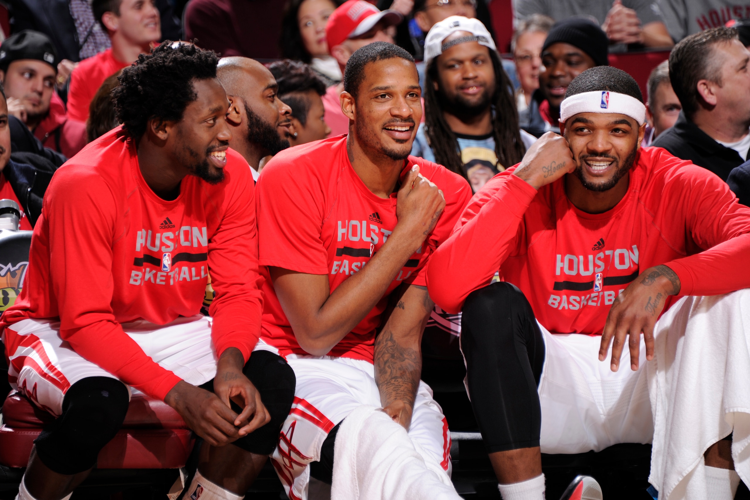 HOUSTON, TX - JANUARY 3: Patrick Beverley #2, Trevor Ariza #1, and Josh Smith #5 of the Houston Rockets sit on the sideline during a game against the Miami Heat on January 3, 2015 at the Toyota Center in Houston, Texas. NOTE TO USER: User expressly acknow