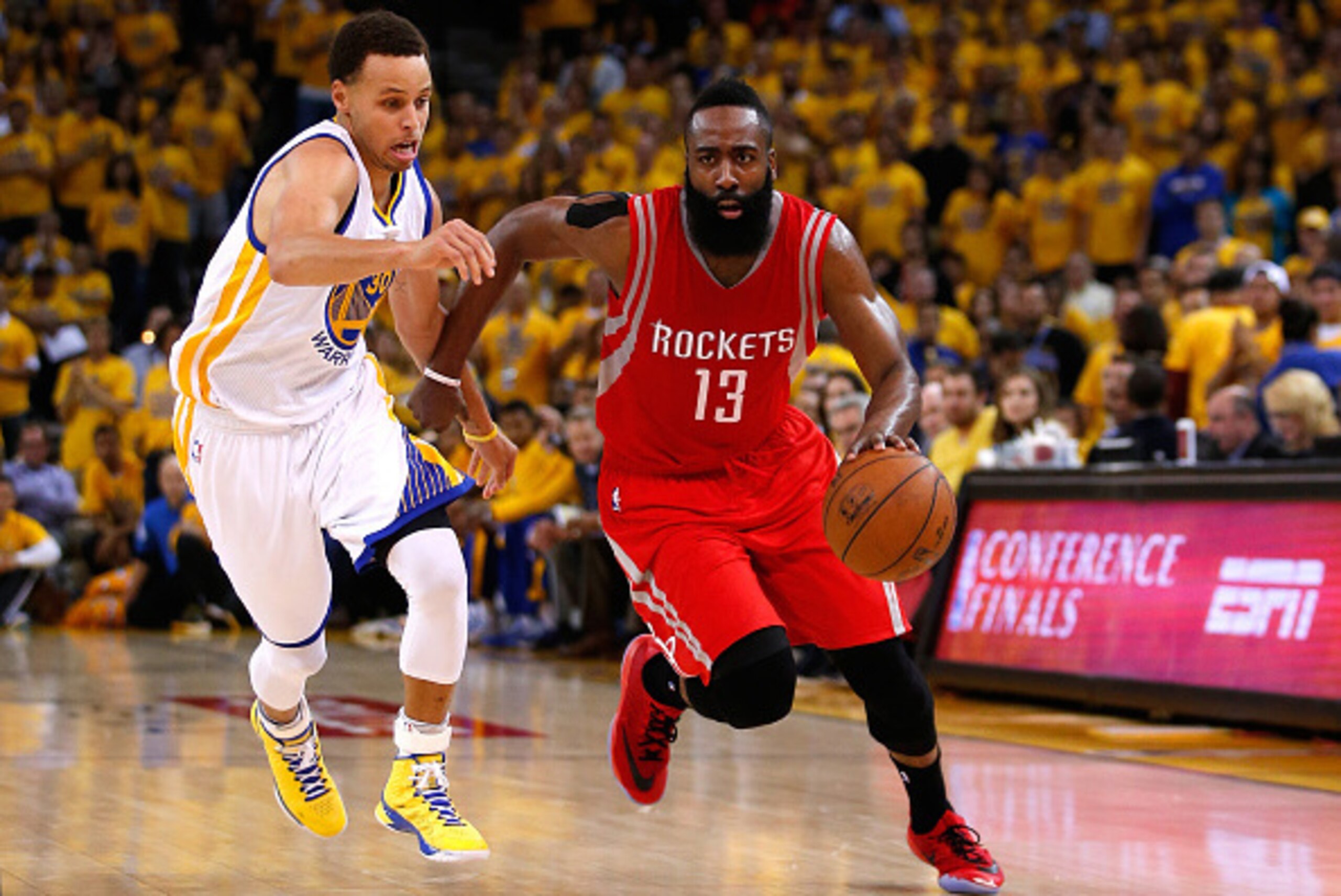 OAKLAND, CA - MAY 21: James Harden #13 of the Houston Rockets handles the ball against Stephen Curry #30 of the Golden State Warriors in the second quarter during game two of the Western Conference Finals of the 2015 NBA PLayoffs at ORACLE Arena on May 21