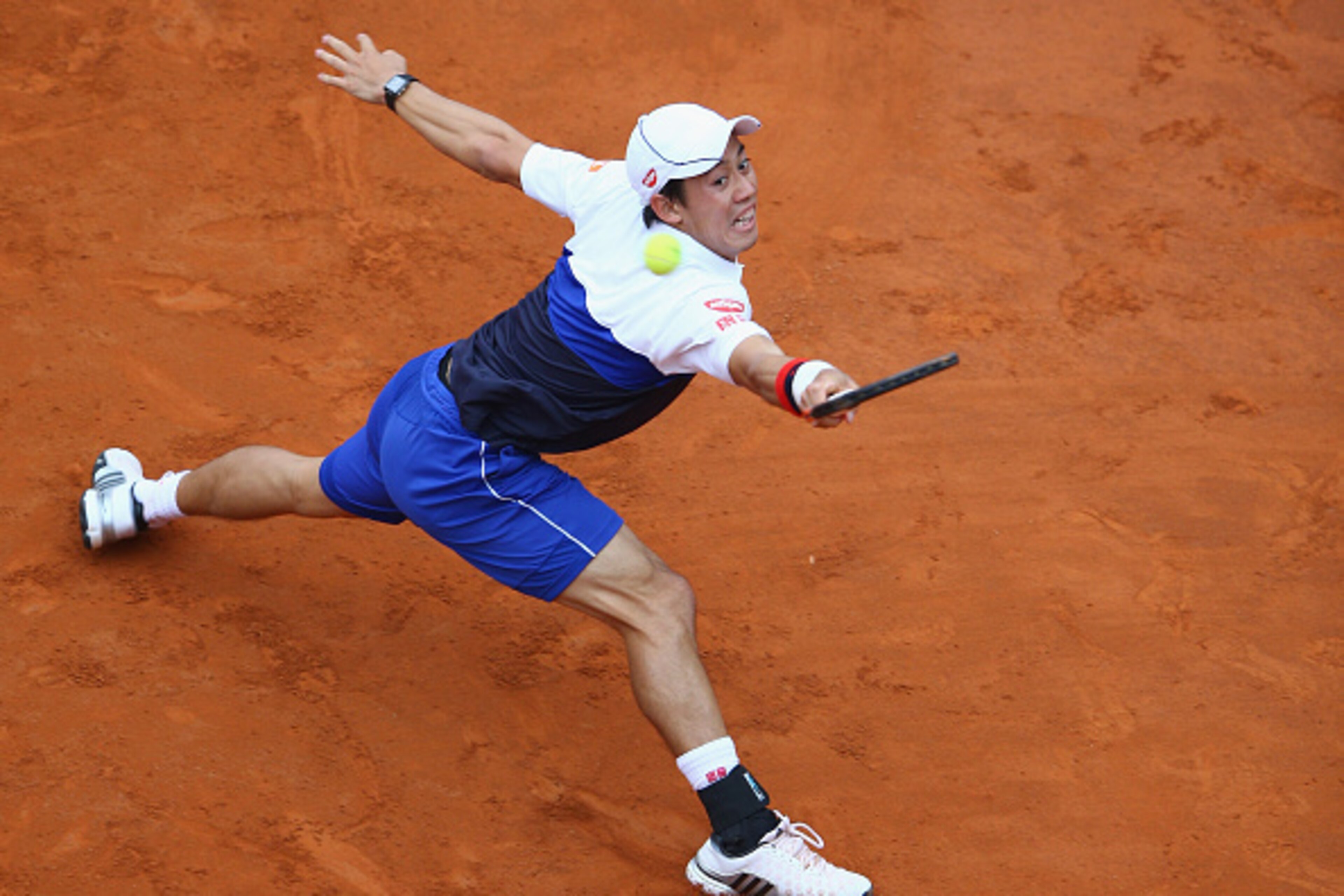 ROME, ITALY - MAY 15:  Kei Nishikori of Japan in action during his Third Round match against Novak Djokovic of Serbia on Day Six of the The Internazionali BNL d'Italia 2015 at Foro Italico on May 15, 2015 in Rome, Italy.  (Photo by Ian Walton/Getty Images