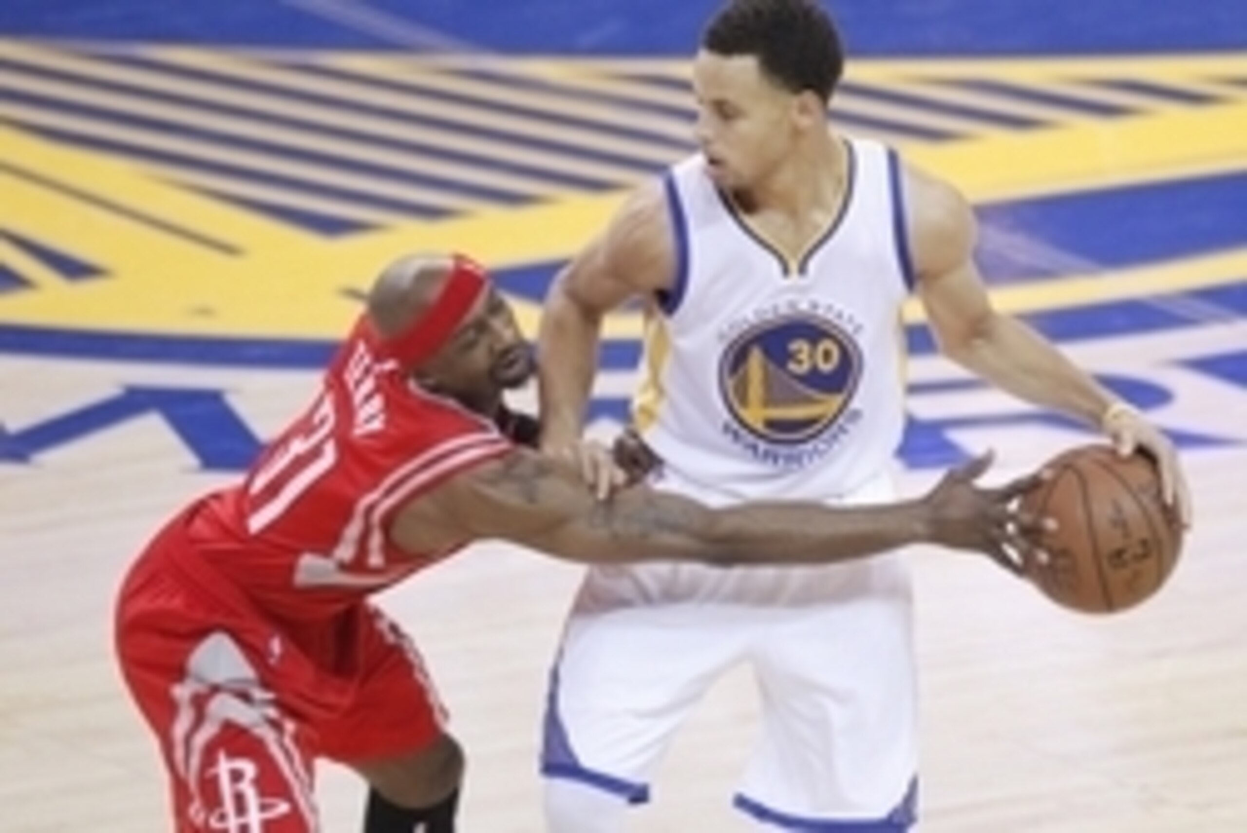 May 21, 2015; Oakland, CA, USA; Golden State Warriors guard Stephen Curry (30) controls the ball against the defense of Houston Rockets guard Jason Terry (31) during the first half in game two of the Western Conference Finals of the NBA Playoffs. at Oracl