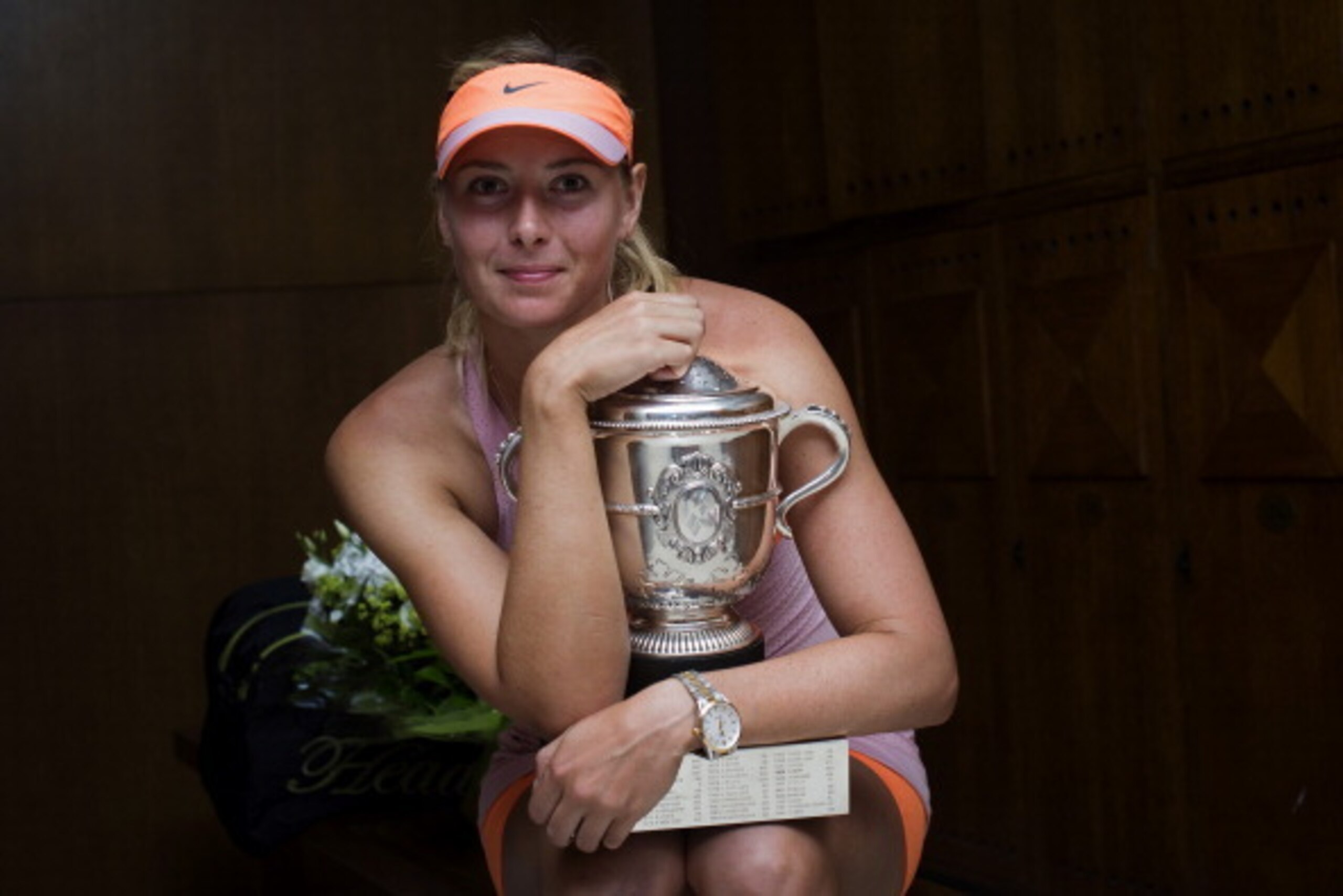 PARIS, FRANCE - JUNE 07:  Maria Sharapova of Russia poses with the Coupe Suzanne Lenglen trophy in her changing room following her victory in her women's singles final match against Simona Halep of Romania on day fourteen of the French Open at Roland Garr