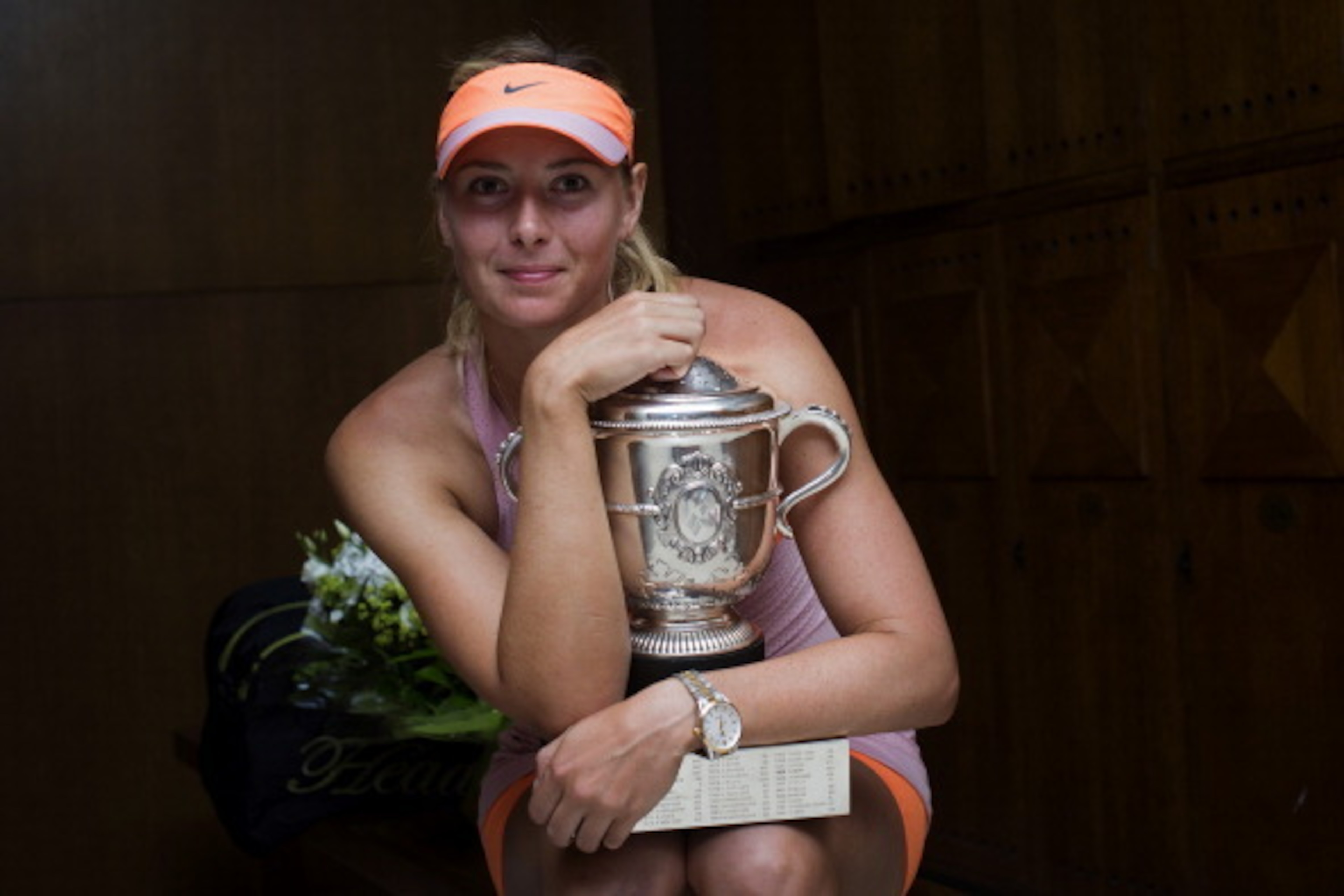 PARIS, FRANCE - JUNE 07:  Maria Sharapova of Russia poses with the Coupe Suzanne Lenglen trophy in her changing room following her victory in her women's singles final match against Simona Halep of Romania on day fourteen of the French Open at Roland Garr