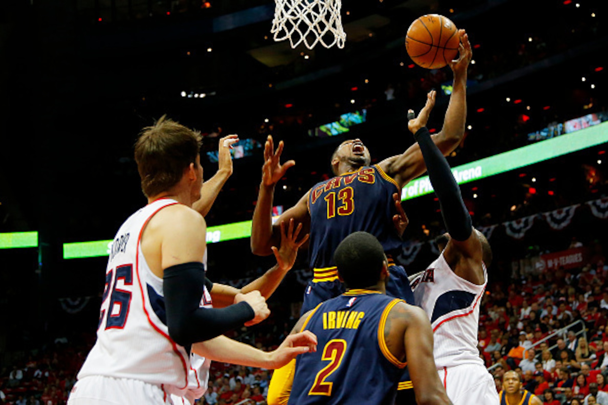 ATLANTA, GA - MAY 20:  Tristan Thompson #13 of the Cleveland Cavaliers rebounds against the Atlanta Hawks in the first half during Game One of the Eastern Conference Finals of the 2015 NBA Playoffs at Philips Arena on May 20, 2015 in Atlanta, Georgia. NOT