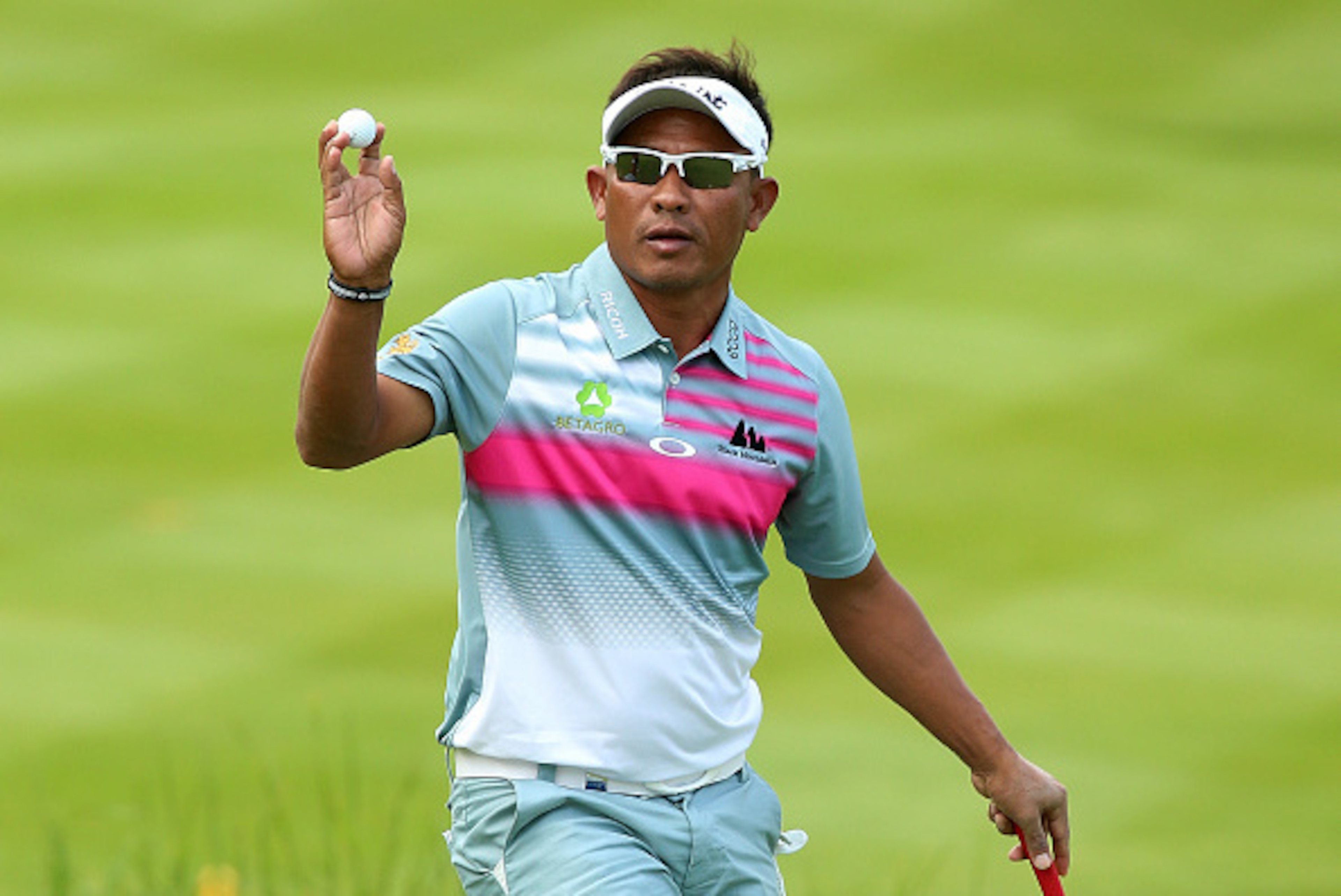 VIRGINIA WATER, ENGLAND - MAY 22:  Thongchai Jaidee of Thailand acknowledges the crowd on the 18th green during day 2 of the BMW PGA Championship at Wentworth on May 22, 2015 in Virginia Water, England.  (Photo by Andrew Redington/Getty Images)