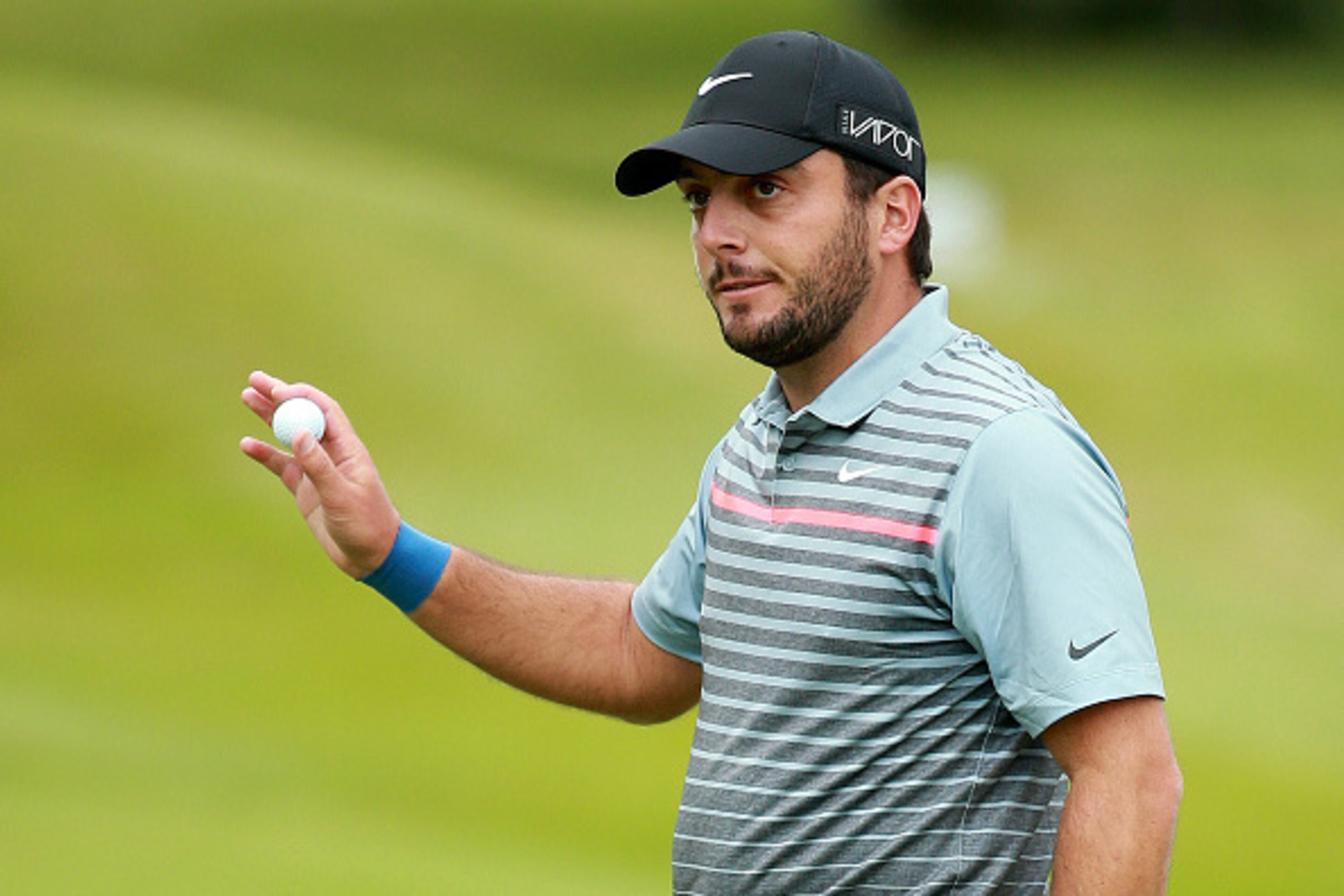 VIRGINIA WATER, ENGLAND - MAY 22:  Francesco Molinari of Italy acknowledges the crowd on the 18th green during day 2 of the BMW PGA Championship at Wentworth on May 22, 2015 in Virginia Water, England.  (Photo by Warren Little/Getty Images)