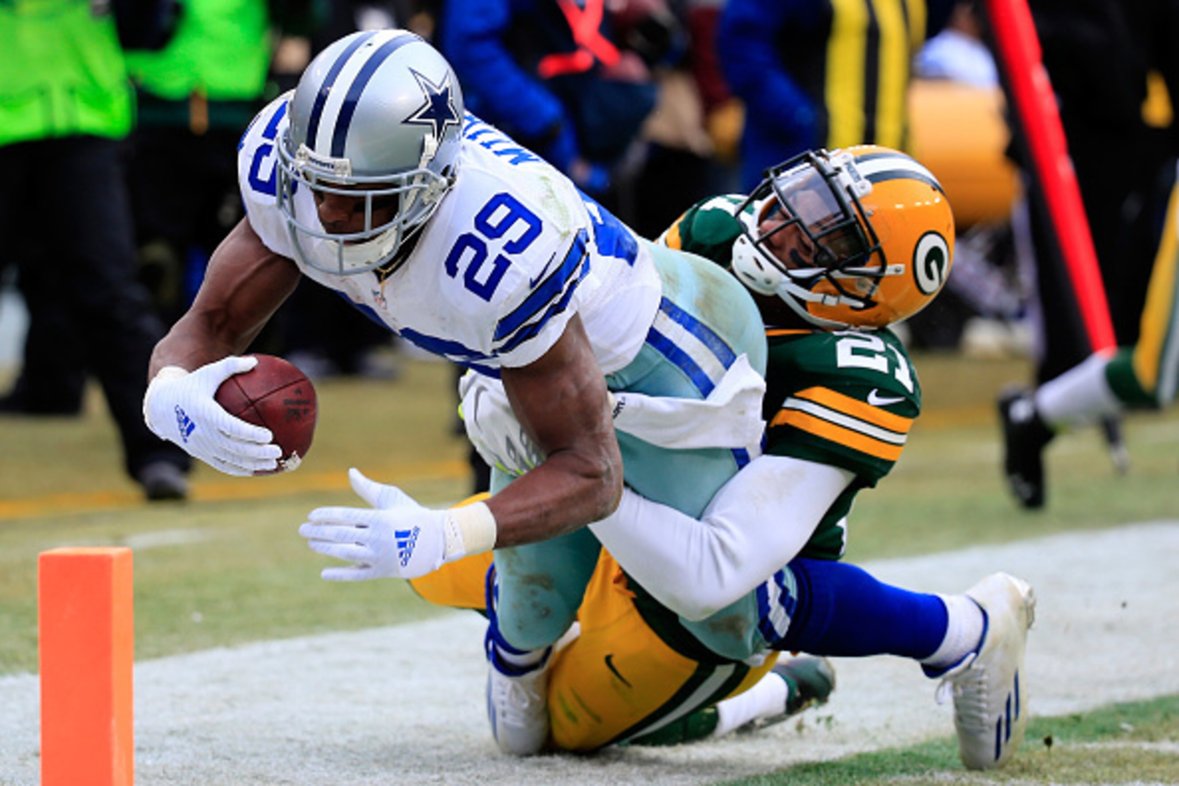 GREEN BAY, WI - JANUARY 11:  DeMarco Murray #29 of the Dallas Cowboys scores a touchdown in the third quarter against  Ha Ha Clinton-Dix #21 of the Green Bay Packers during the 2015 NFC Divisional Playoff game at Lambeau Field on January 11, 2015 in Green