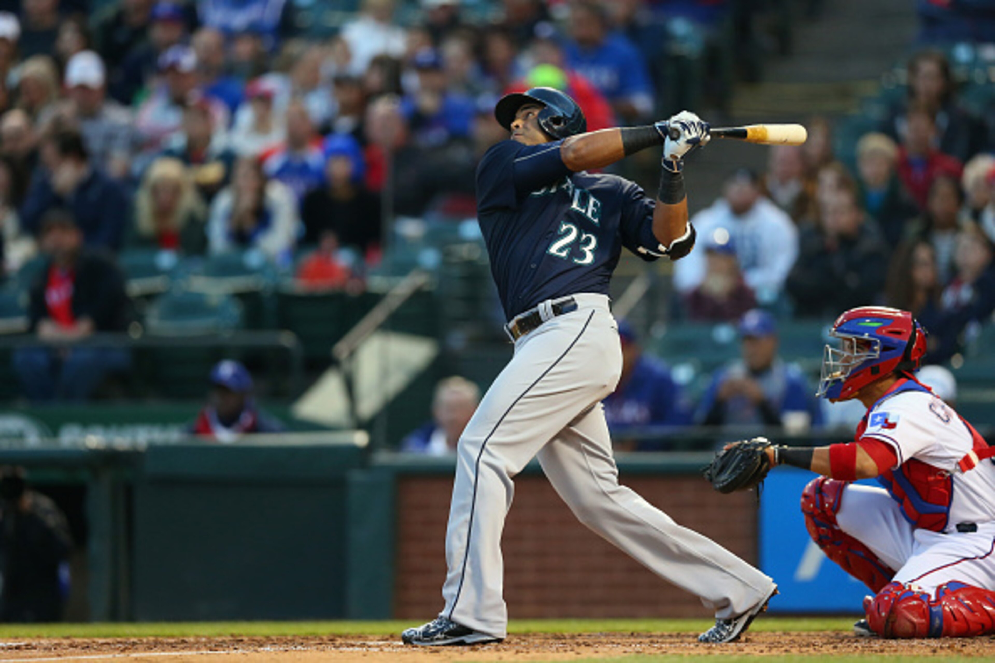 ARLINGTON, TX - APRIL 28:  Nelson Cruz #23 of the Seattle Mariners hits a triple against the Texas Rangers in the fourth inning at Globe Life Park in Arlington on April 28, 2015 in Arlington, Texas.  (Photo by Ronald Martinez/Getty Images)