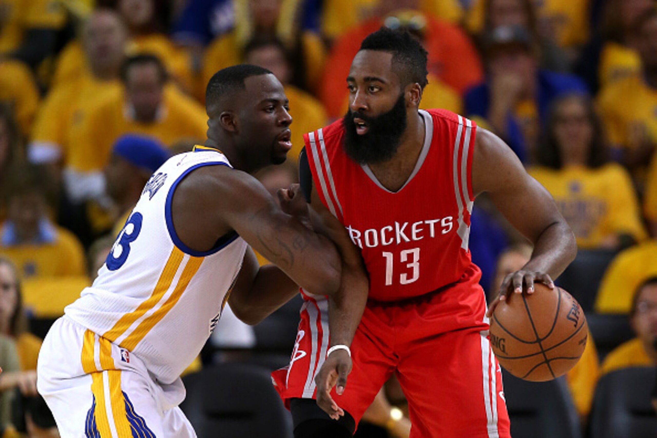 OAKLAND, CA - MAY 21: James Harden #13 of the Houston Rockets handles the ball against Draymond Green #23 of the Golden State Warriors in the third quarter during game two of the Western Conference Finals of the 2015 NBA PLayoffs at ORACLE Arena on May 21
