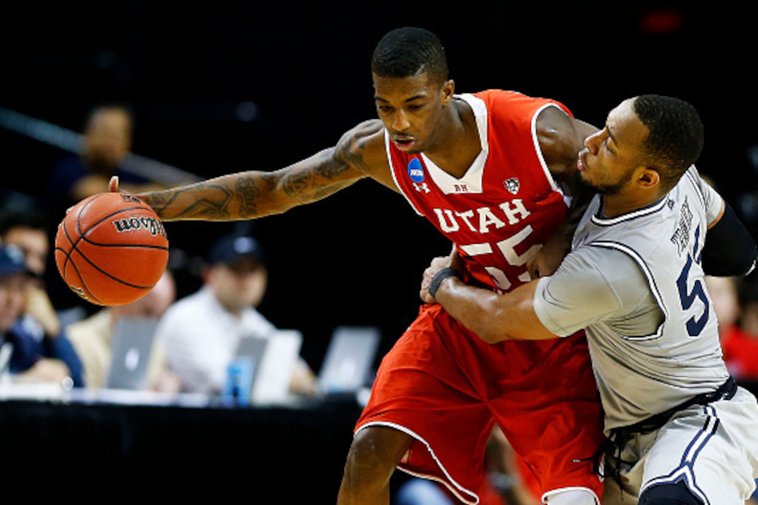 PORTLAND, OR - MARCH 21:  Delon Wright #55 of the Utah Utes drives against Jabril Trawick #55 of the Georgetown Hoyas in the second half during the third round of the 2015 NCAA Men's Basketball Tournament at Moda Center on March 21, 2015 in Portland, Oreg