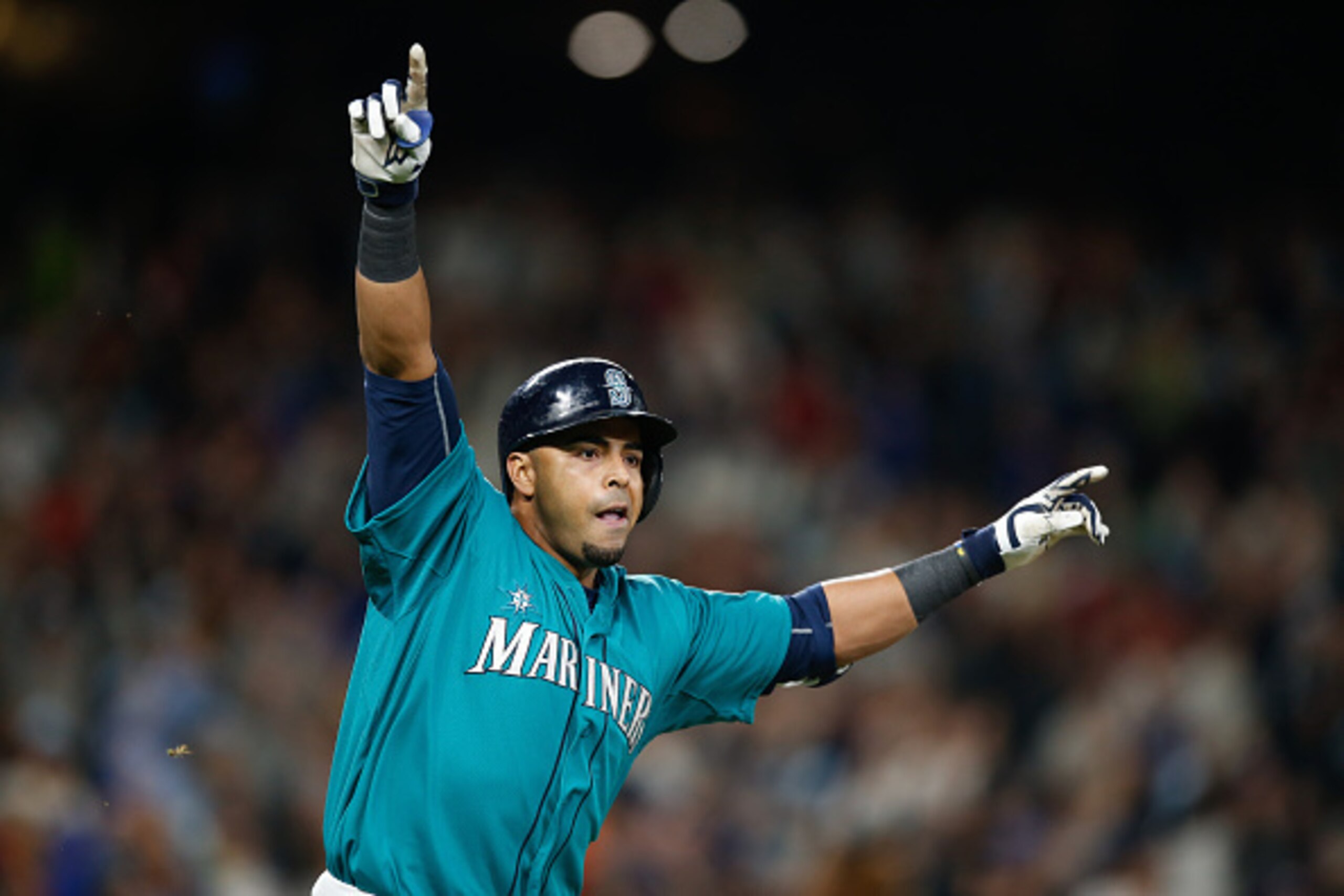 SEATTLE, WA - MAY 15:  Nelson Cruz #23 of the Seattle Mariners celebrates after hitting a walkoff single to defeat the Boston Red Sox 2-1 at Safeco Field on May 15, 2015 in Seattle, Washington.  (Photo by Otto Greule Jr/Getty Images)