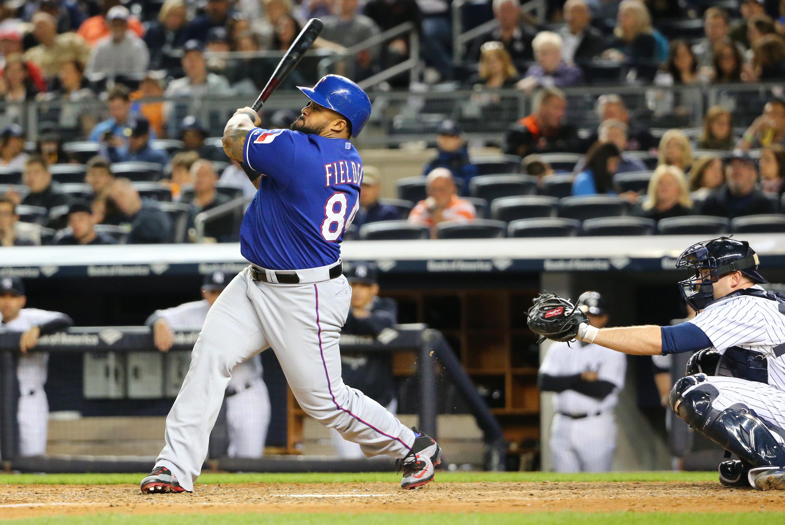 May 22, 2015; Bronx, NY, USA; Texas Rangers designated hitter Prince Fielder (84) hots a home run to center during the seventh inning against the New York Yankees at Yankee Stadium. The Rangers won 10-9. Mandatory Credit: Anthony Gruppuso-USA TODAY Sports