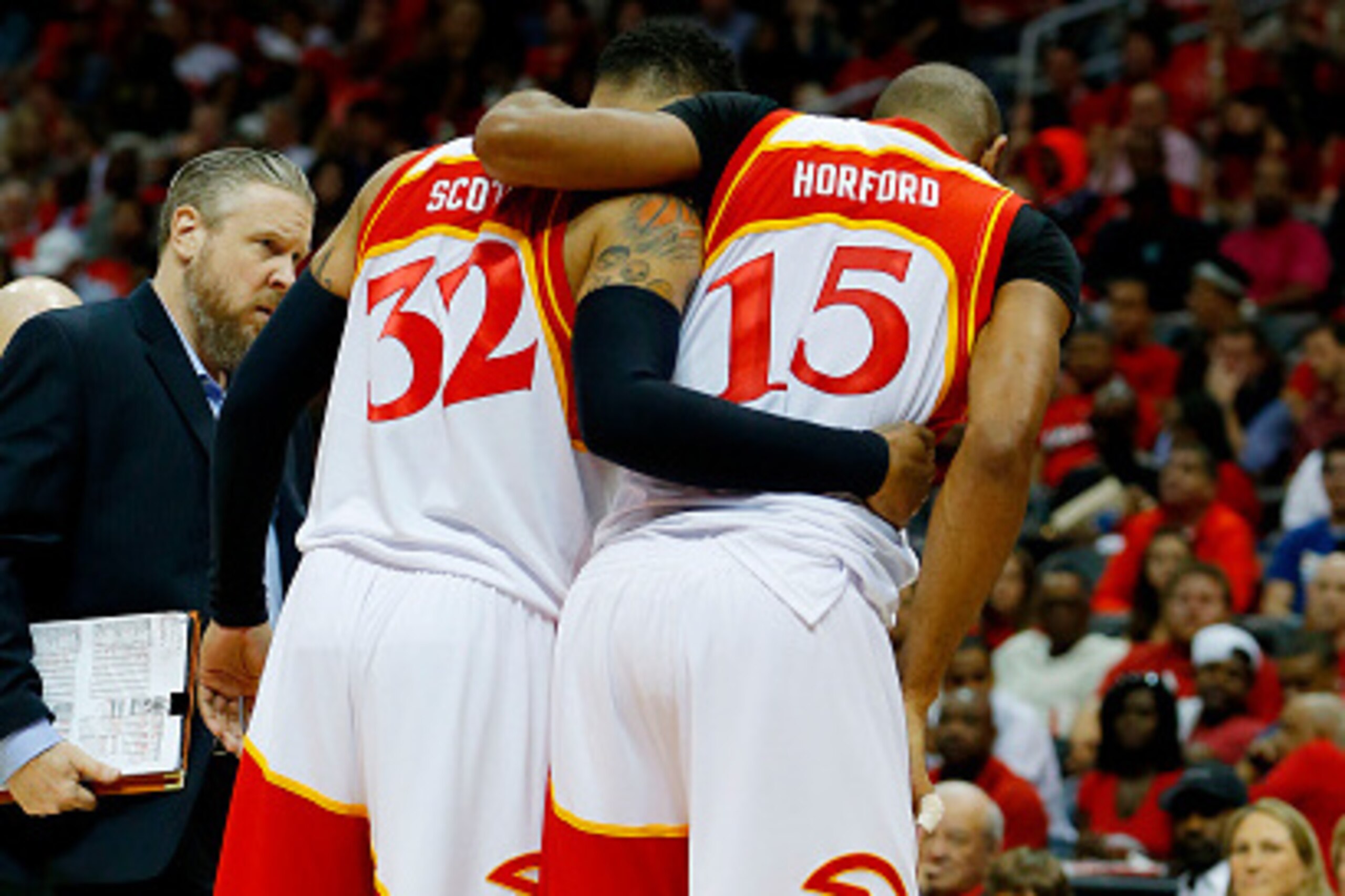 ATLANTA, GA - MAY 22:  Al Horford #15 is helped off the court by Mike Scott #32 of the Atlanta Hawks after being injured in the fourth quarter against the Cleveland Cavaliers during Game Two of the Eastern Conference Finals of the 2015 NBA Playoffs at Phi
