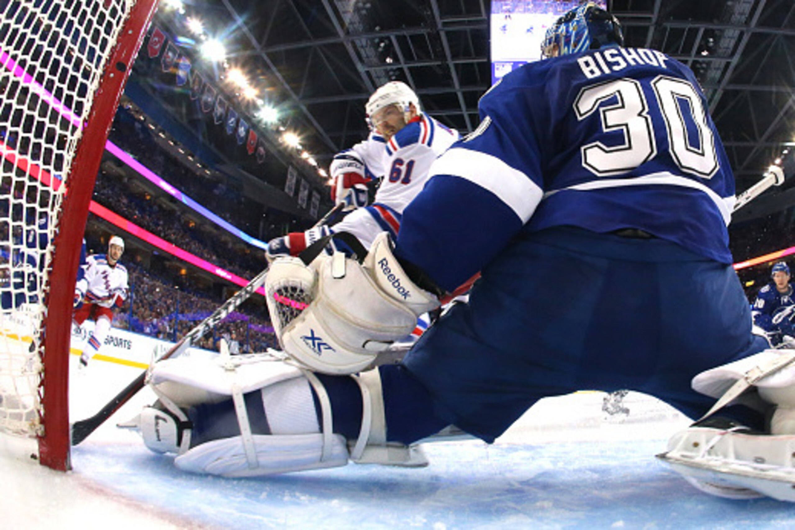 TAMPA, FL - MAY 22:  Ben Bishop #30 of the Tampa Bay Lightning tends goal against Rick Nash #61 of the New York Rangers during the second period in Game Four of the Eastern Conference Finals during the 2015 NHL Stanley Cup Playoffs at Amalie Arena on May 