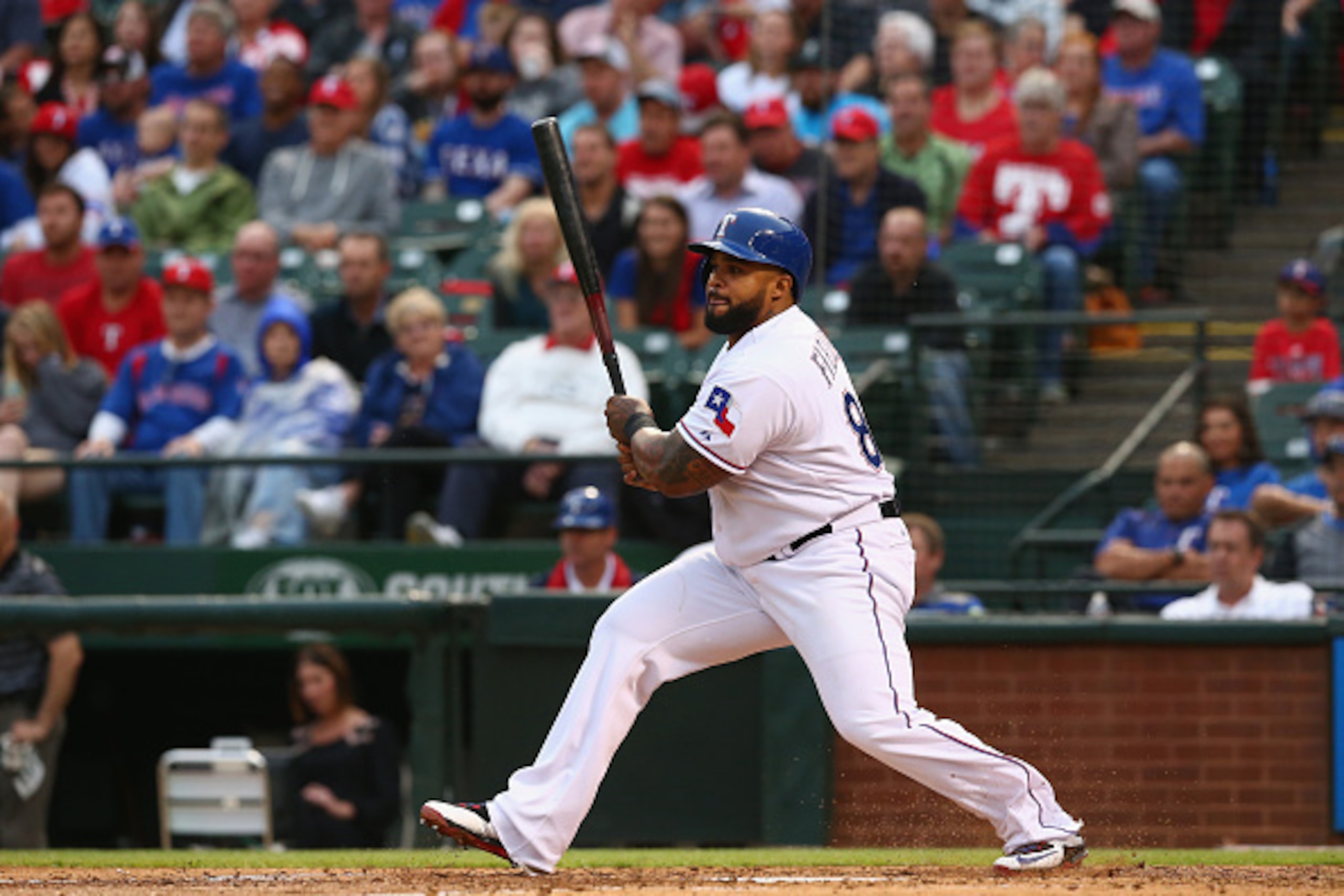 ARLINGTON, TX - MAY 12:  Prince Fielder #84 of the Texas Rangers hits a rbi single against the Kansas City Royals in the third inning at Globe Life Park in Arlington on May 12, 2015 in Arlington, Texas.  (Photo by Ronald Martinez/Getty Images)