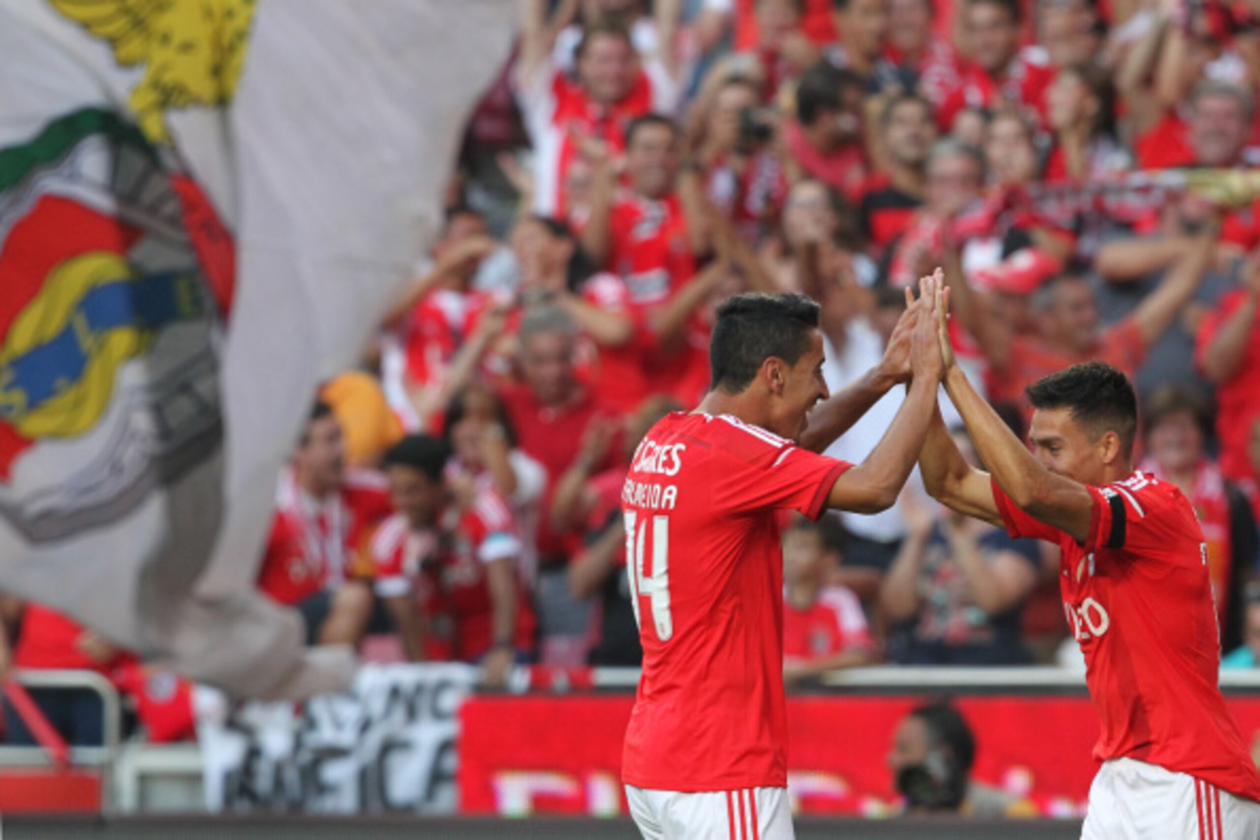 LISBON, PORTUGAL - AUGUST 31: Benfica's midfielder Nicolas Gaitan and Benfica's defender Andre Almeida celebrates Benfica's goal during the Primeira Liga match between SL Benfica and Sporting CP at Estadio da Luz on August 31, 2014 in Lisbon, Portugal. (P