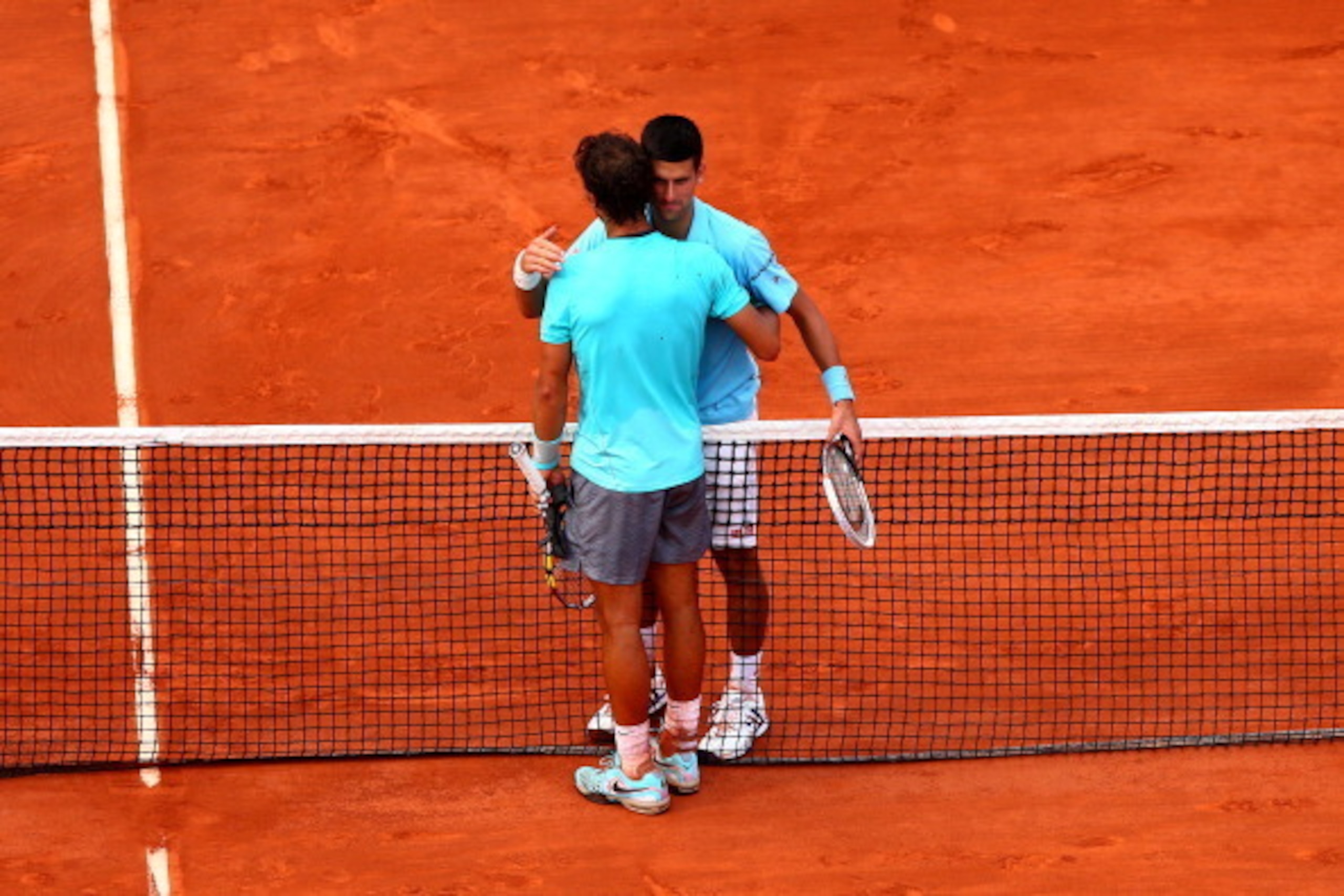 PARIS, FRANCE - JUNE 08:  Rafael Nadal of Spain shakes hands with Novak Djokovic of Serbia after their men's singles final match on day fifteen of the French Open at Roland Garros on June 8, 2014 in Paris, France.  (Photo by Dan Istitene/Getty Images)