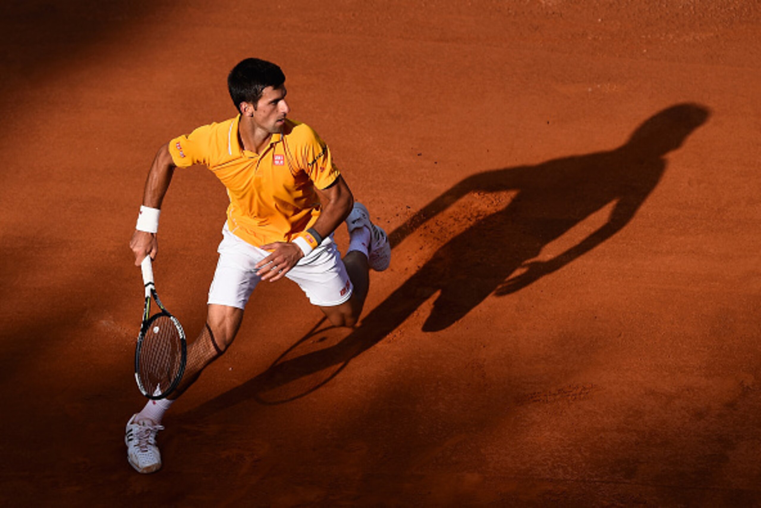 ROME, ITALY - MAY 17:  Novak Djokovic of Serbia in action during his victory over Roger Federer of Switzerland in the Men's Singles Final on Day Eight of The Internazionali BNL d'Italia 2015 at the Foro Italico on May 17, 2015 in Rome, Italy.  (Photo by M