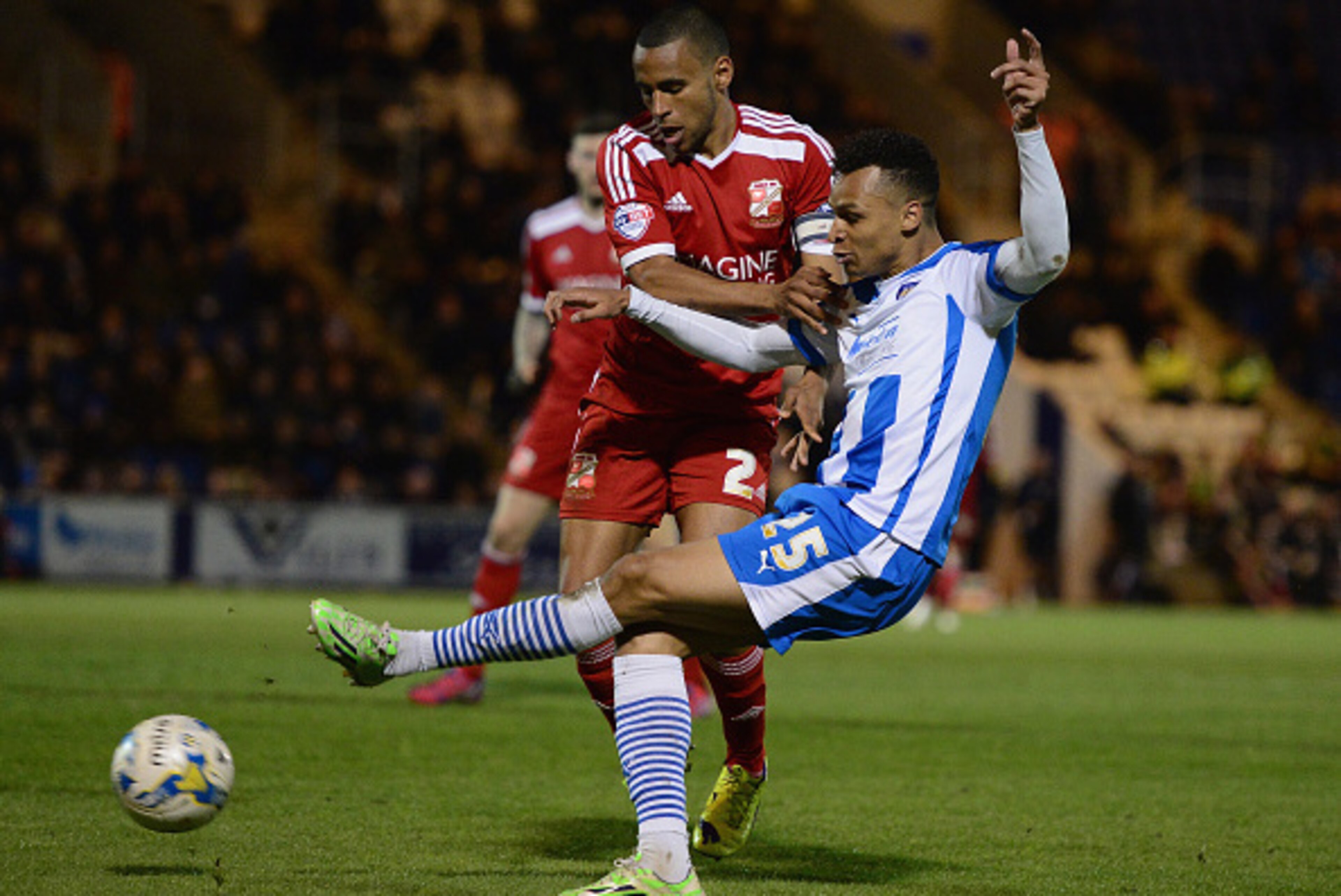 COLCHESTER, ENGLAND - APRIL 28: Jacob Murphy of Colchester United battles with Nathan Thompson of Swindon Town during the Sky Bet League One match between Colchester United and Swindon Town at Colchester Community Stadium on April 28, 2015 in Colchester, COLCHESTER, ENGLAND - APRIL 28: Jacob Murphy of Colchester United battles with Nathan Thompson of Swindon Town during the Sky Bet League One match between Colchester United and Swindon Town at Colchester Community Stadium on April 28, 2015 in Colchester,