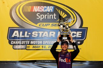 CHARLOTTE, NC - MAY 16:  Denny Hamlin, driver of the #11 FedEx Express Toyota, poses in victory lane after winning the NASCAR Sprint Cup Series Sprint All-Star Race at Charlotte Motor Speedway on May 16, 2015 in Charlotte, North Carolina.  (Photo by Jerry