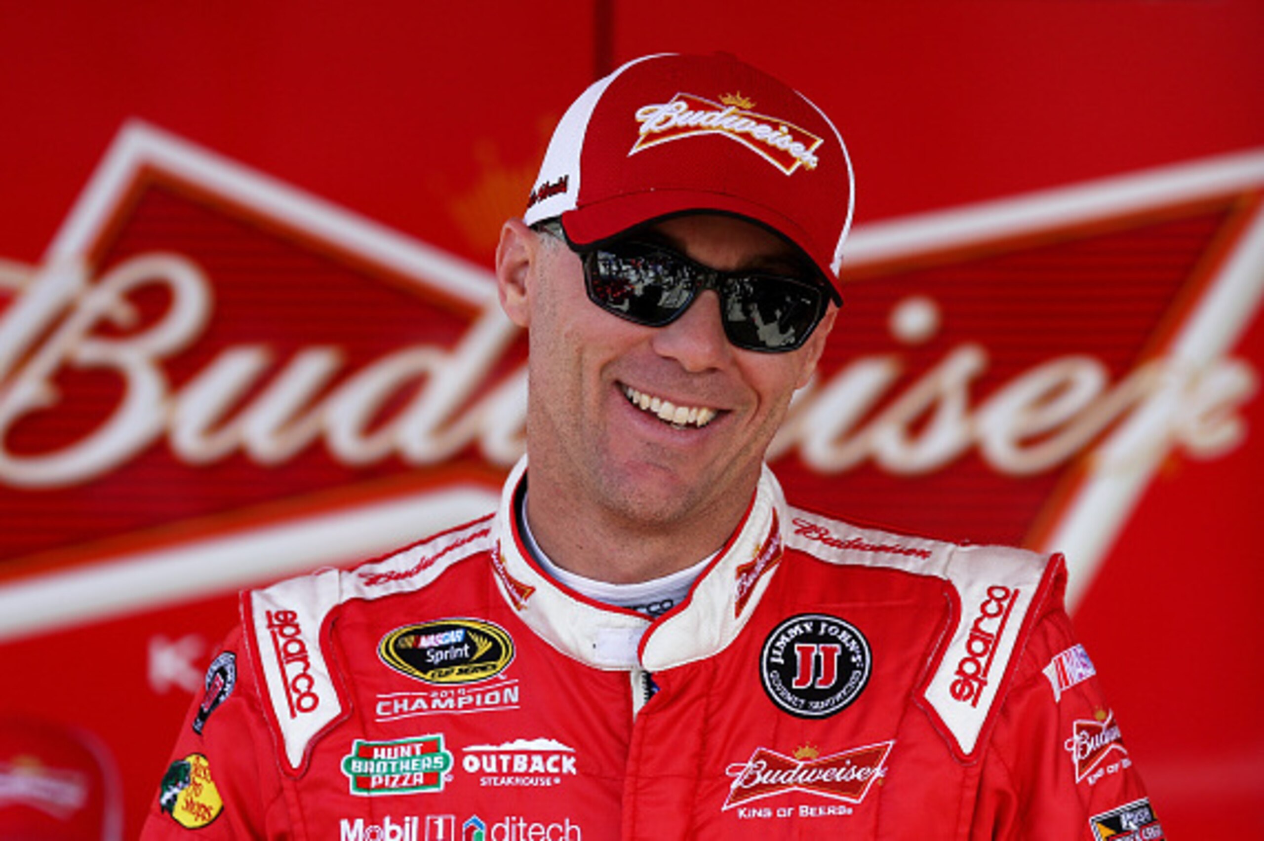 FORT WORTH, TX - APRIL 10: Kevin Harvick, driver of the #4 Budweiser/Jimmy John's Chevrolet, walks through the garage area during practice for the NASCAR Sprint Cup Series Duck Commander 500 at Texas Motor Speedway on April 10, 2015 in Fort Worth, Texas. FORT WORTH, TX - APRIL 10: Kevin Harvick, driver of the #4 Budweiser/Jimmy John's Chevrolet, walks through the garage area during practice for the NASCAR Sprint Cup Series Duck Commander 500 at Texas Motor Speedway on April 10, 2015 in Fort Worth, Texas.