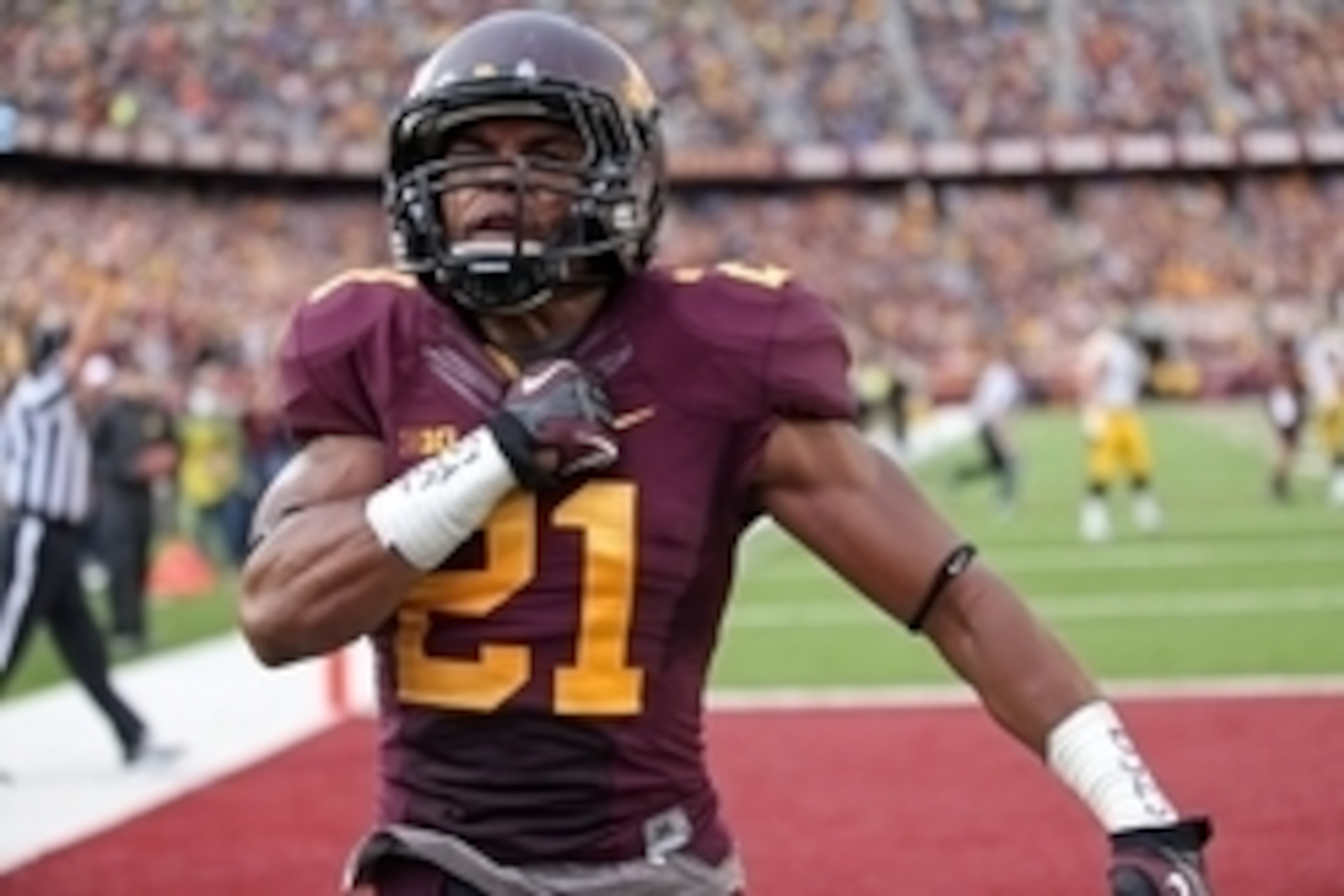 Sep 28, 2013; Minneapolis, MN, USA; Minnesota Golden Gophers defensive back Brock Vereen (21) celebrates after intercepting a pass in the second half against the Iowa Hawkeyes at TCF Bank Stadium. The Hawkeyes won 23-7. Mandatory Credit: Jesse Johnson-USA