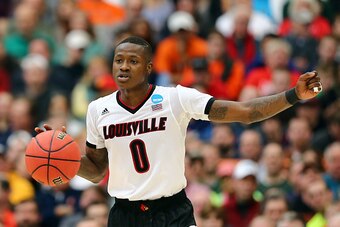 SYRACUSE, NY - MARCH 29:  Terry Rozier #0 of the Louisville Cardinals looks down court in the first half of the game against the Michigan State Spartans during the East Regional Final of the 2015 NCAA Men's Basketball Tournament at Carrier Dome on March 2