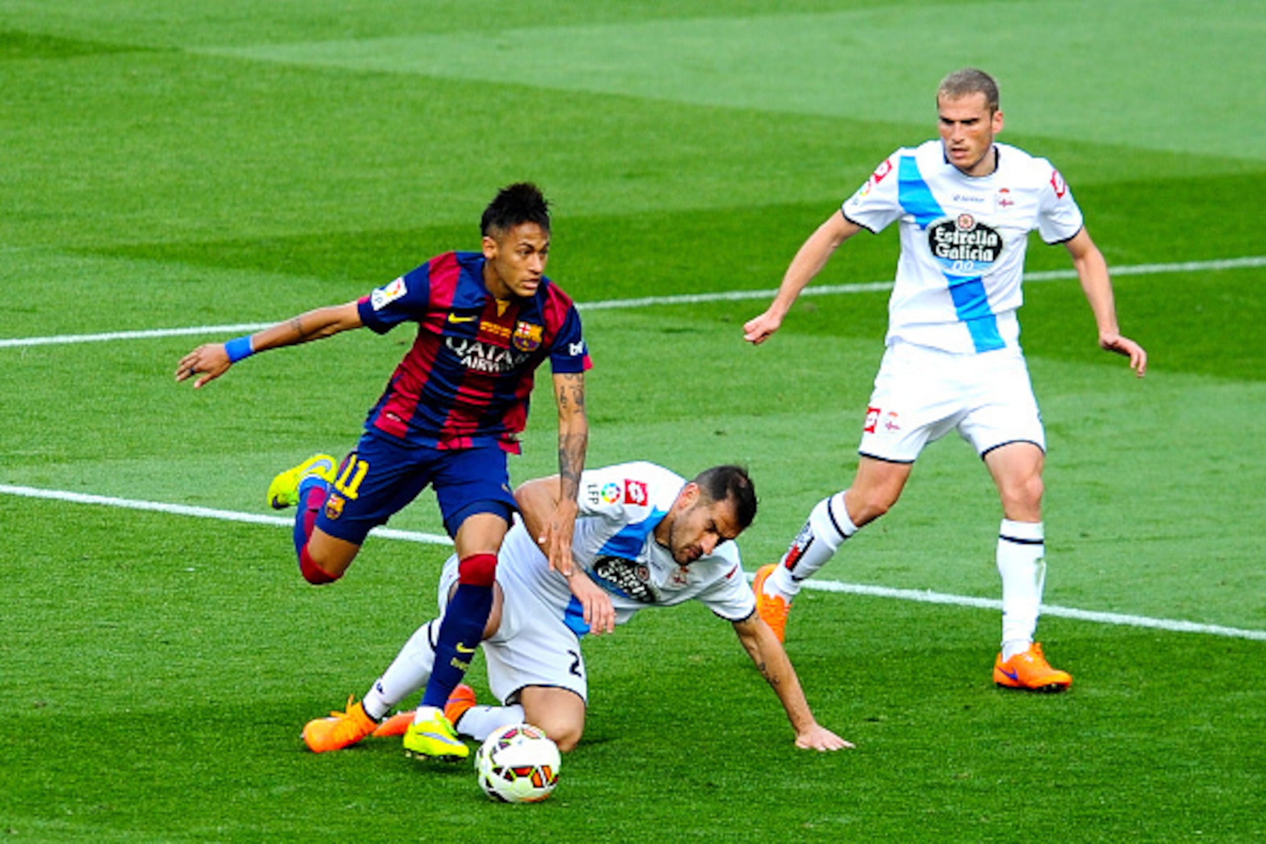 BARCELONA, SPAIN - MAY 23: Neymar of FC Barcelona competes for the ball with Albert Lopo (C) and Alex Bergantinos of RC Deportivo La Coruna of RC Deportivo La Coruna during the La Liga match between FC Barcelona and RC Deportivo de la Coruna at Camp Nou BARCELONA, SPAIN - MAY 23: Neymar of FC Barcelona competes for the ball with Albert Lopo (C) and Alex Bergantinos of RC Deportivo La Coruna of RC Deportivo La Coruna during the La Liga match between FC Barcelona and RC Deportivo de la Coruna at Camp Nou