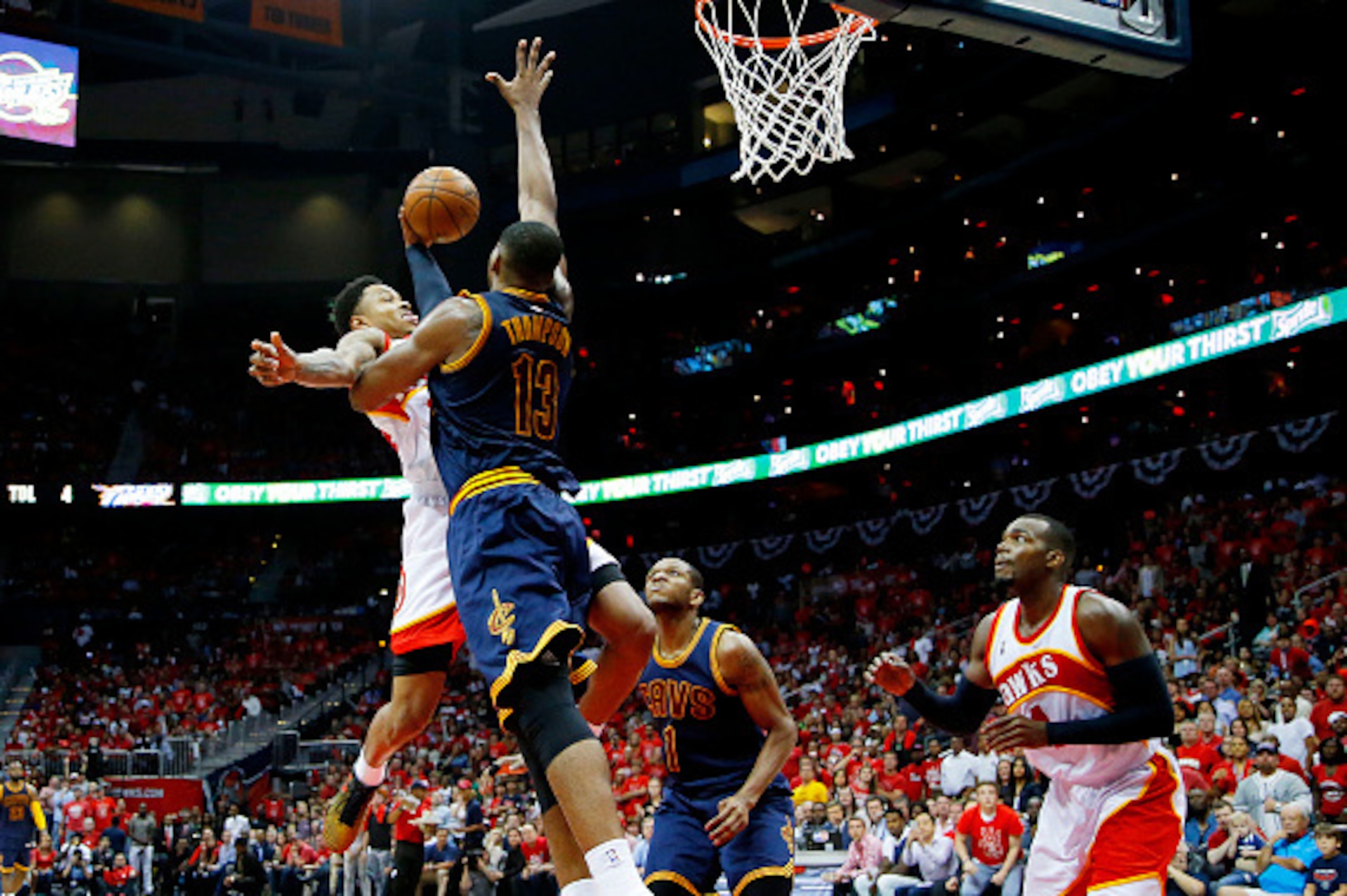 ATLANTA, GA - MAY 22:  Jeff Teague #0 of the Atlanta Hawks goes up against Tristan Thompson #13 of the Cleveland Cavaliers in the third quarter during Game Two of the Eastern Conference Finals of the 2015 NBA Playoffs at Philips Arena on May 22, 2015 in A