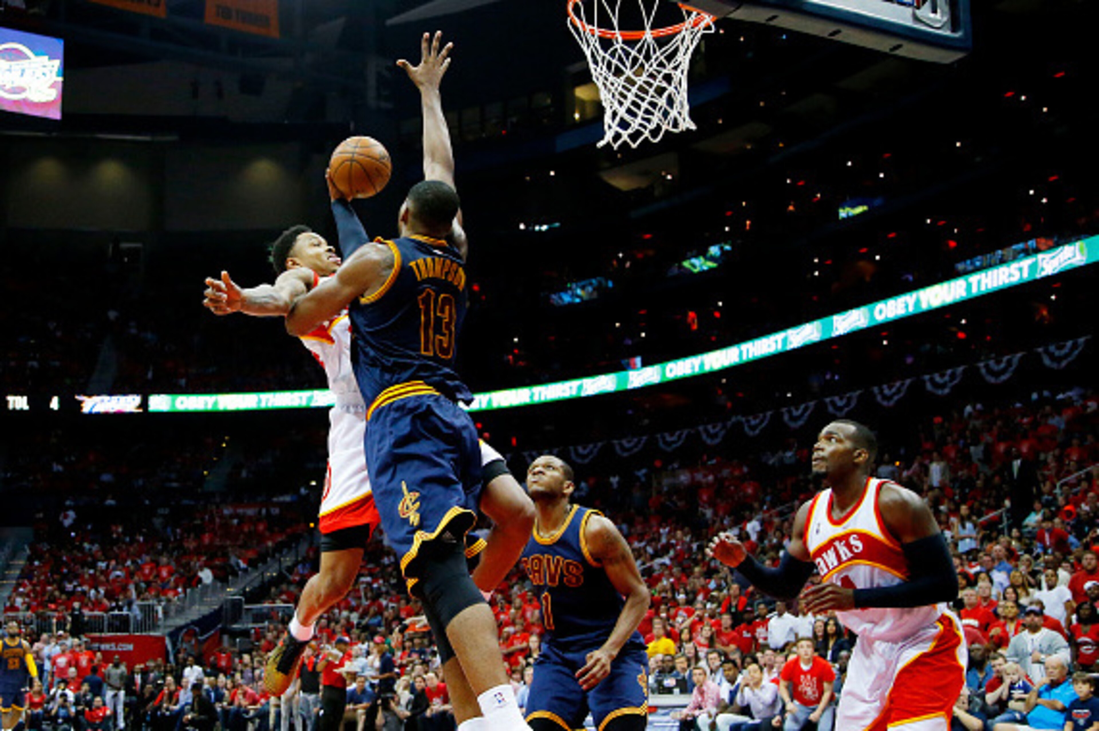 ATLANTA, GA - MAY 22:  Jeff Teague #0 of the Atlanta Hawks goes up against Tristan Thompson #13 of the Cleveland Cavaliers in the third quarter during Game Two of the Eastern Conference Finals of the 2015 NBA Playoffs at Philips Arena on May 22, 2015 in A