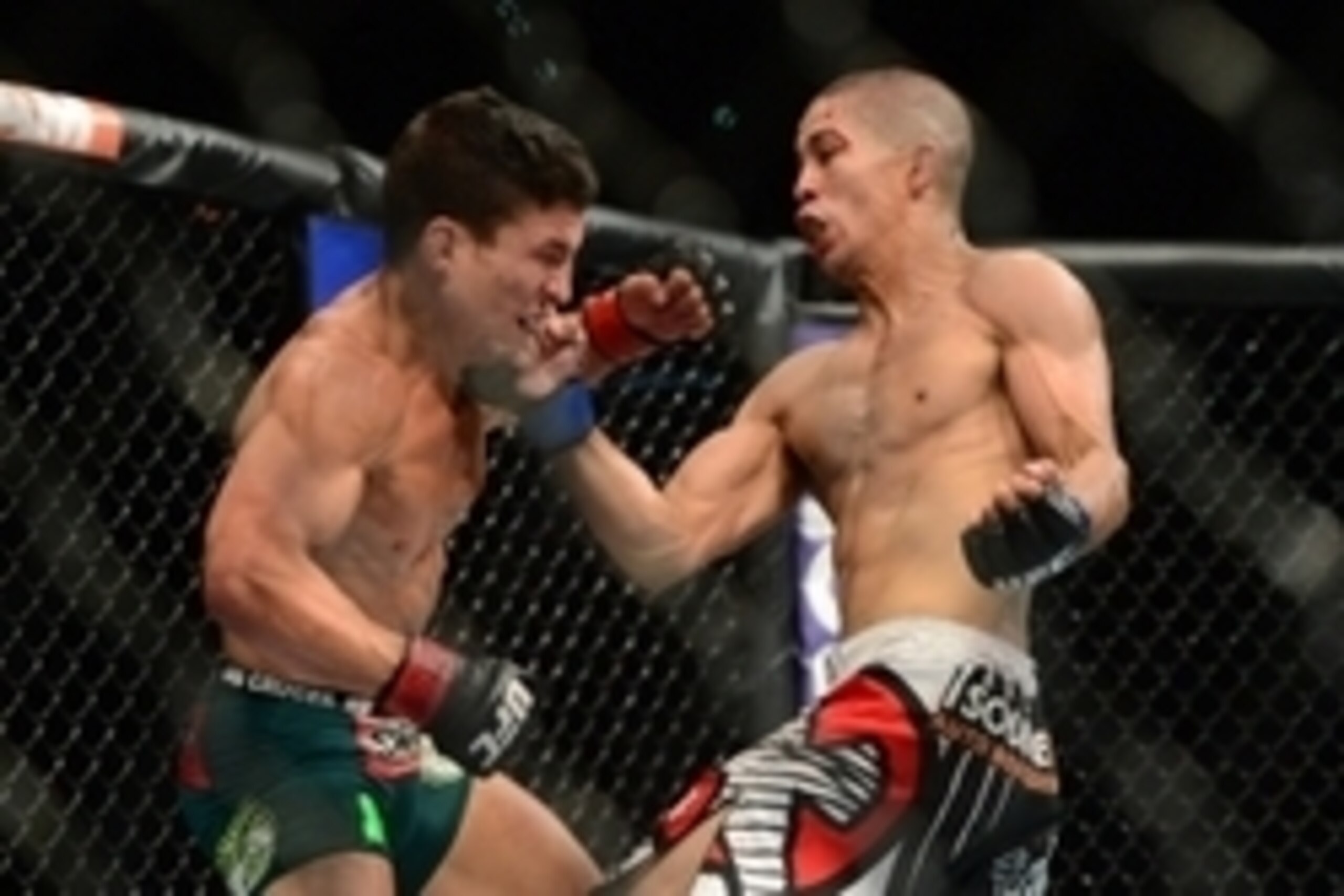 May 23, 2015; Las Vegas, NV, USA; Joseph Benavidez (red gloves) and John Moraga (blue gloves) fight during their flyweight bout during UFC 187 at MGM Grand Garden Arena.  Benavidez won via unanimous decision. Mandatory Credit: Joe Camporeale-USA TODAY Spo