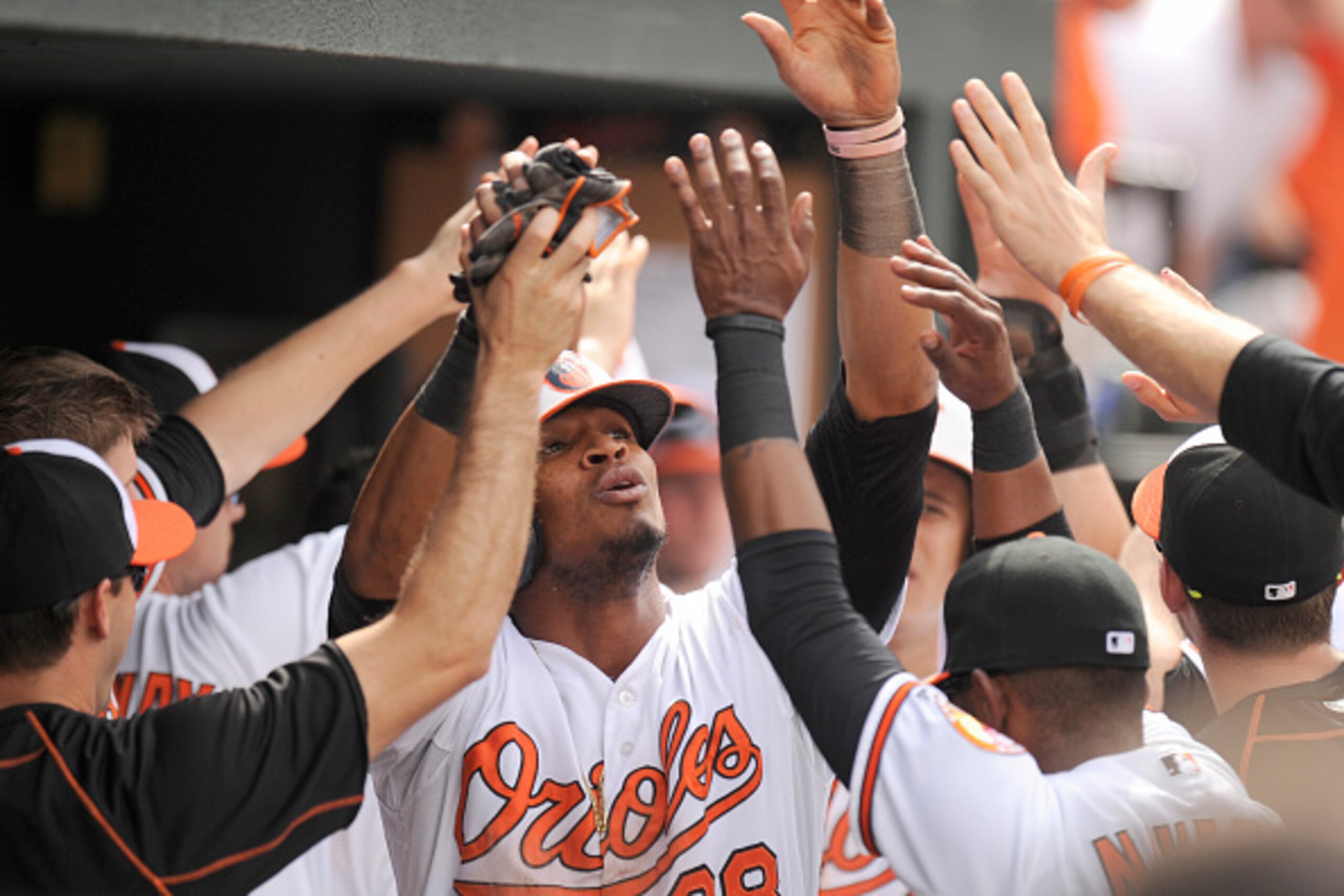 BALTIMORE, MD - MAY 17:  Jimmy Paredes #38 of the Baltimore Orioles celebrates scoring a run on a Adam Jones #10 (not pictured) hit in the eighth inning during a baseball game against the Los Angeles Angels of Anaheim at Oriole Park at Camden Yards on May