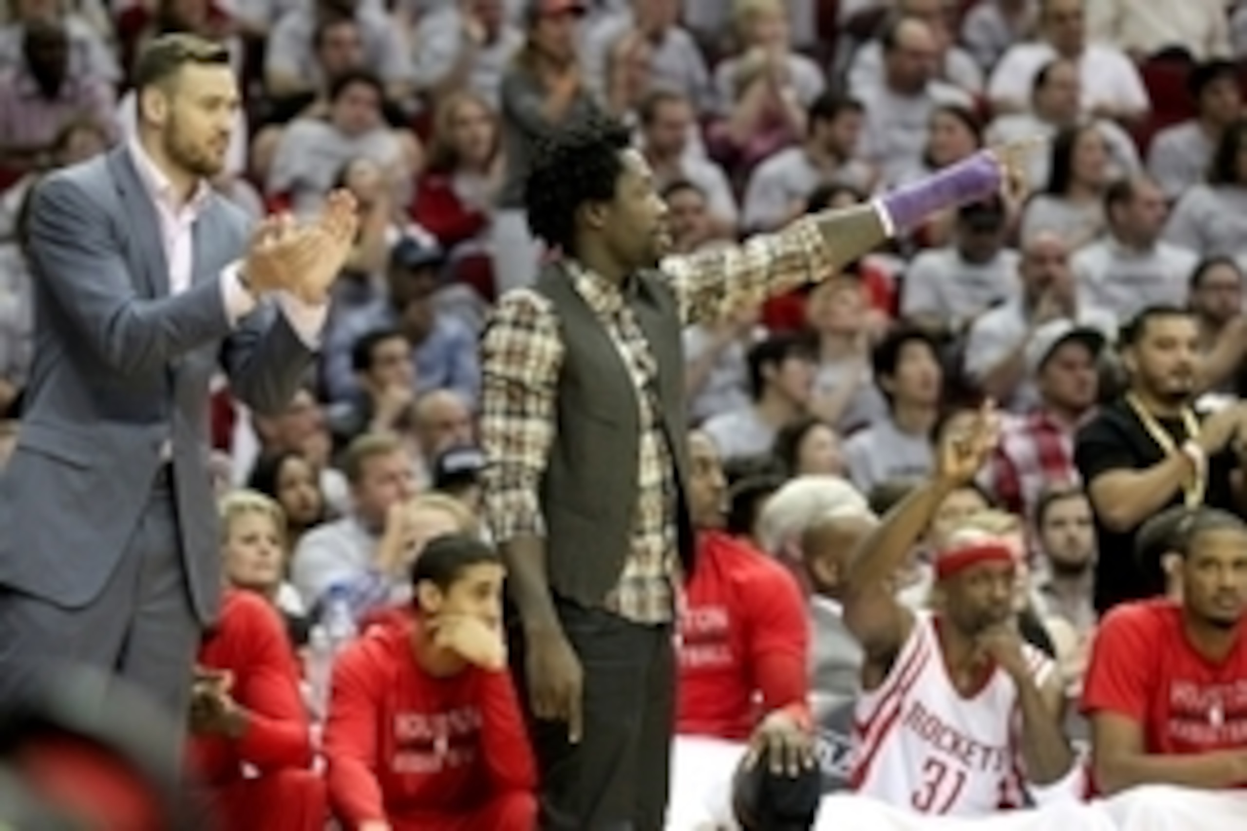 May 4, 2015; Houston, TX, USA;  Houston Rockets injured forward Donatas Motiejunas (20) and guard Patrick Beverley (2) cheer against the Los Angeles Clippers in the second half in game one of the second round of the NBA Playoffs at Toyota Center. Los Ange