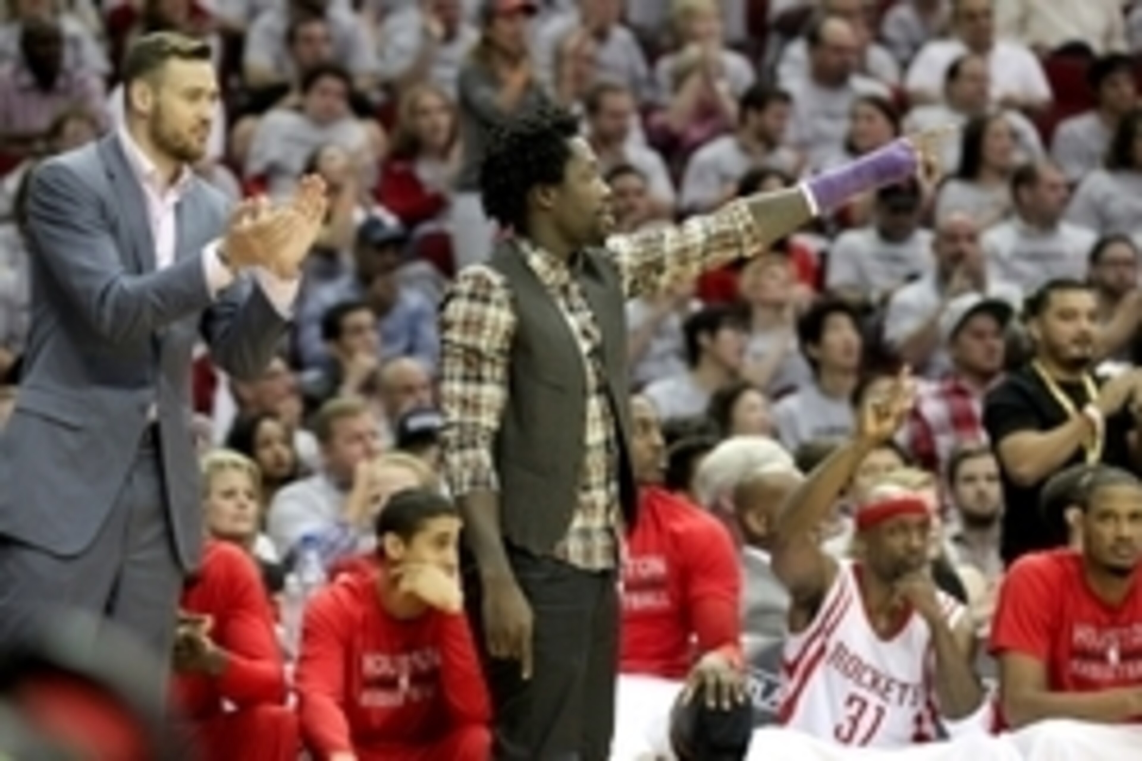 May 4, 2015; Houston, TX, USA;  Houston Rockets injured forward Donatas Motiejunas (20) and guard Patrick Beverley (2) cheer against the Los Angeles Clippers in the second half in game one of the second round of the NBA Playoffs at Toyota Center. Los Ange