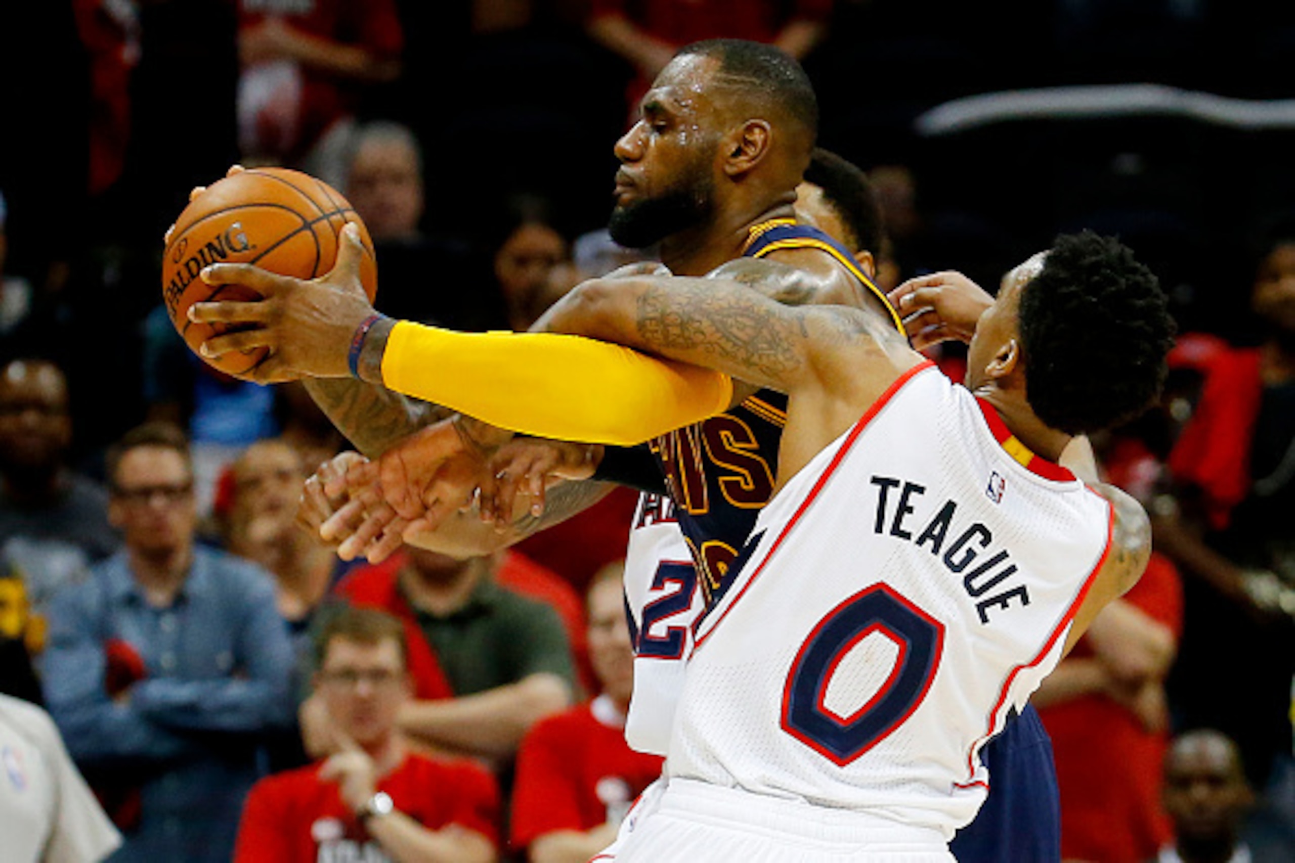 ATLANTA, GA - MAY 20:  Jeff Teague #0 of the Atlanta Hawks tries ot strip the ball from LeBron James #23 of the Cleveland Cavaliers in the second half during Game One of the Eastern Conference Finals of the 2015 NBA Playoffs at Philips Arena on May 20, 20